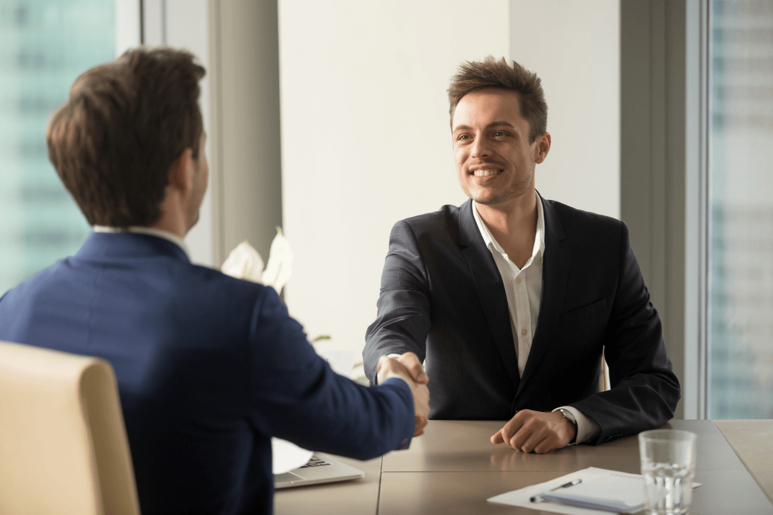 image of two executives and a recuriter asking "what do you want to work here"