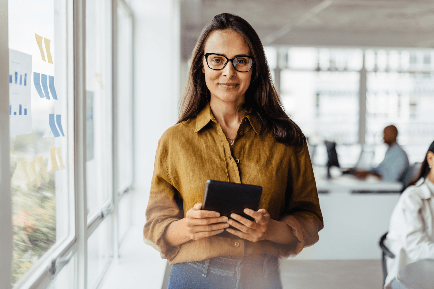 a female job professional smiling because she has landed her dream job because she took action on her job search.