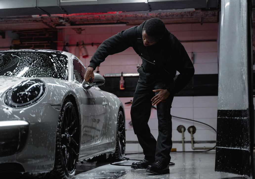 profesional detailer washing a car
