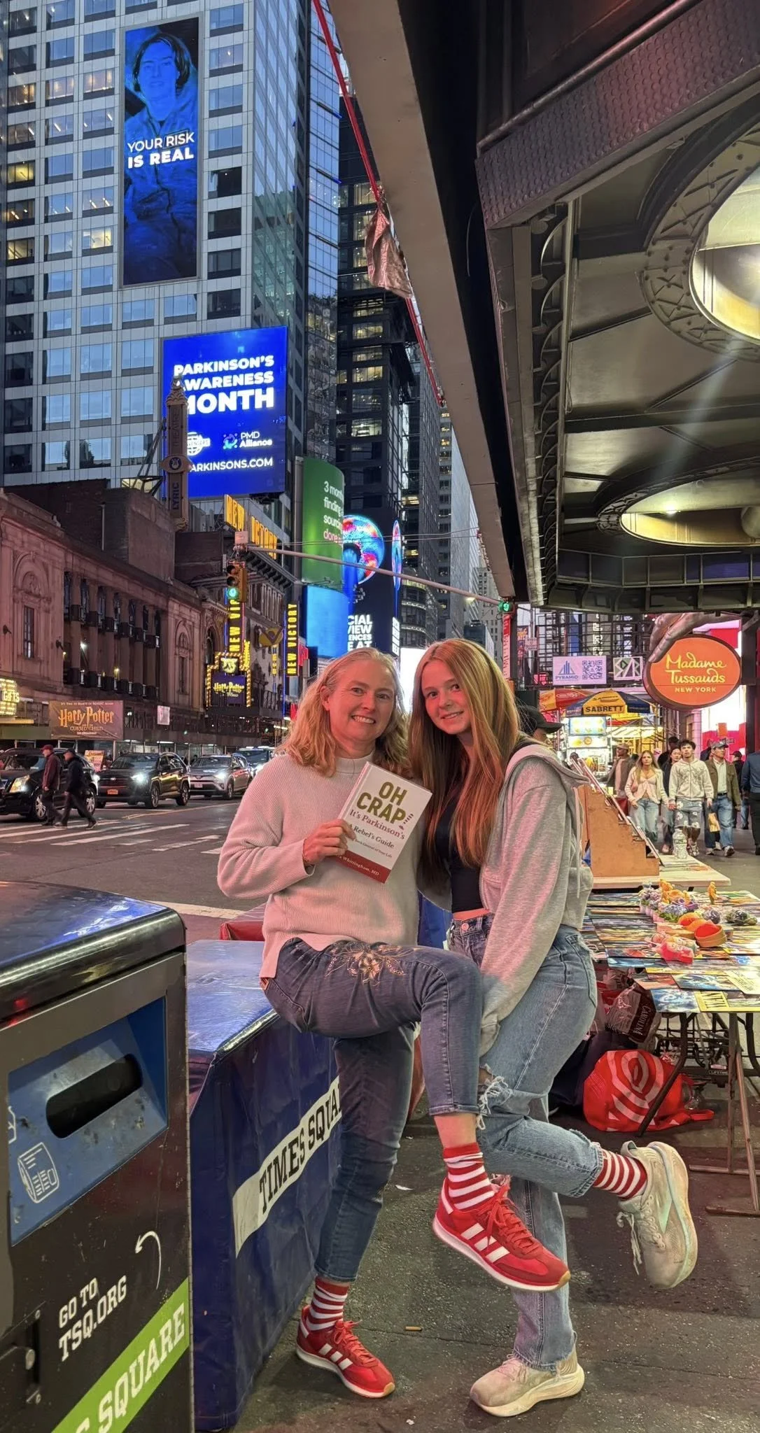 Oh Crap! It's Parkinson's author Sara Whittingham, MD with the @PDAvengers and @PMDAlliance billboard in Times Square.