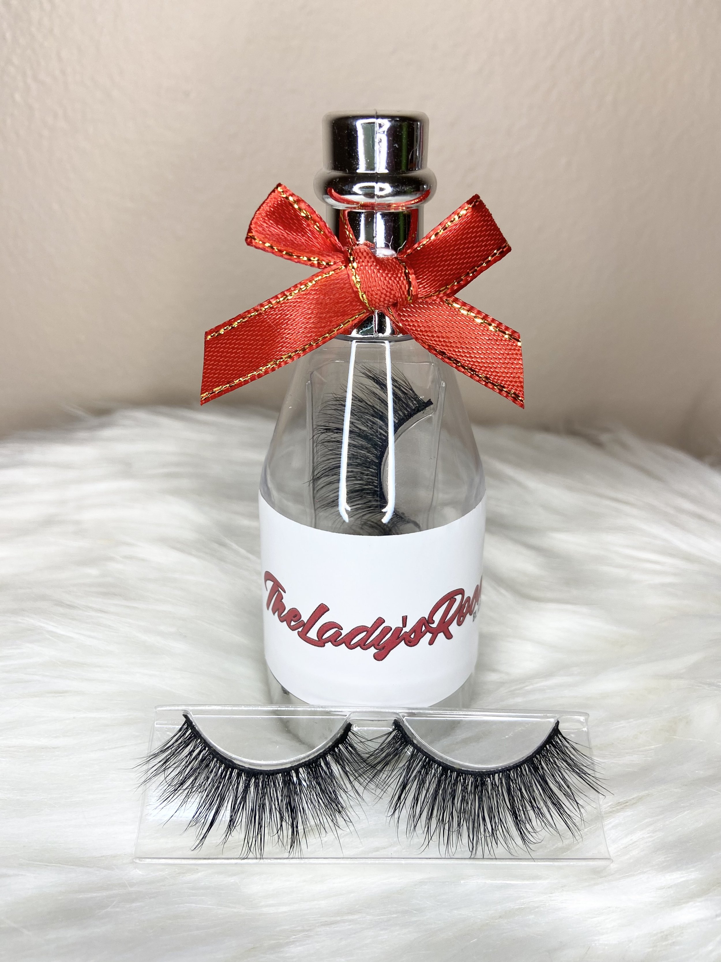 simple short eyelash strips in a wine bottle packaging