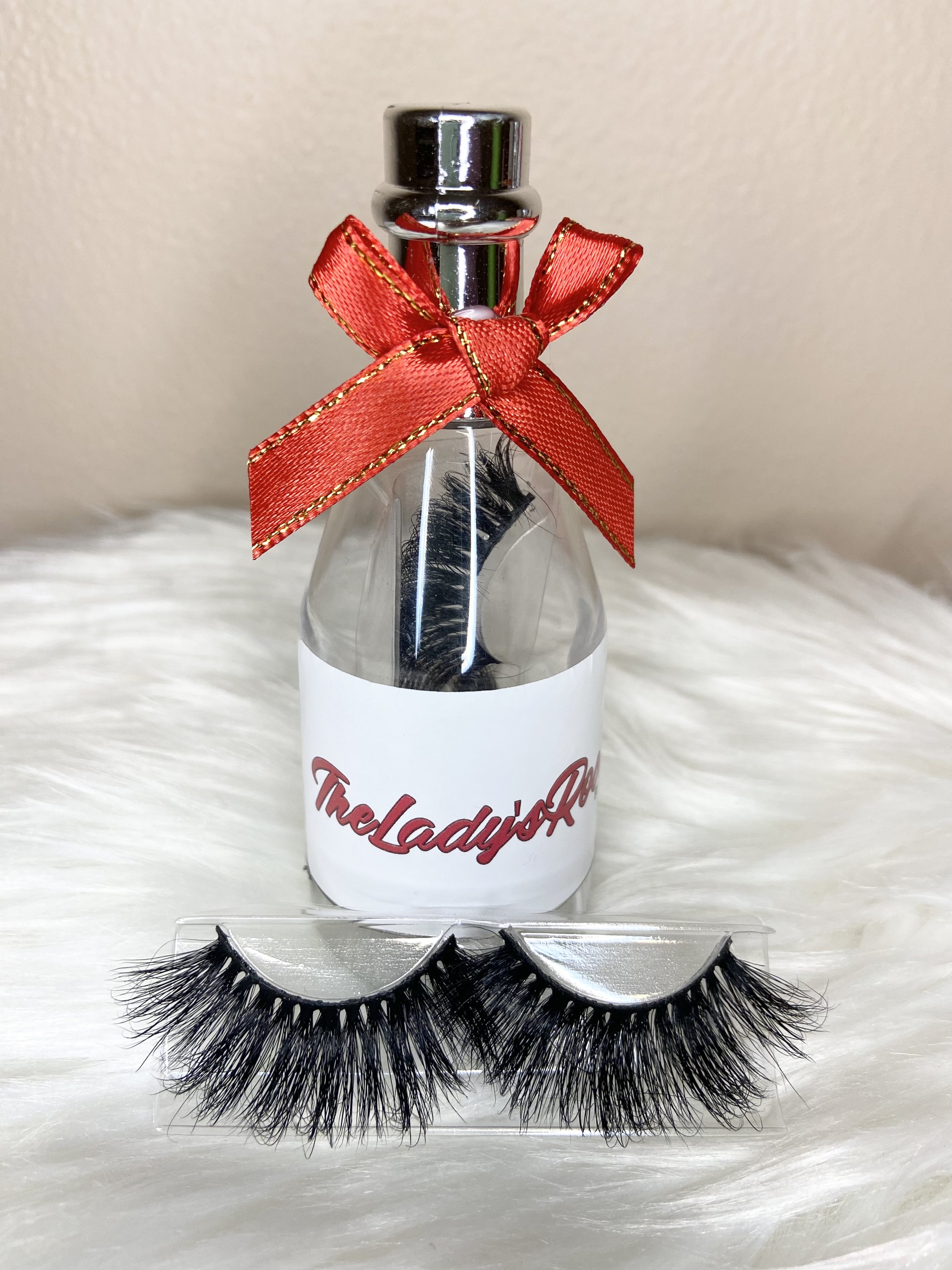 fluffy dramatic eyelash strips in a wine bottle packaging