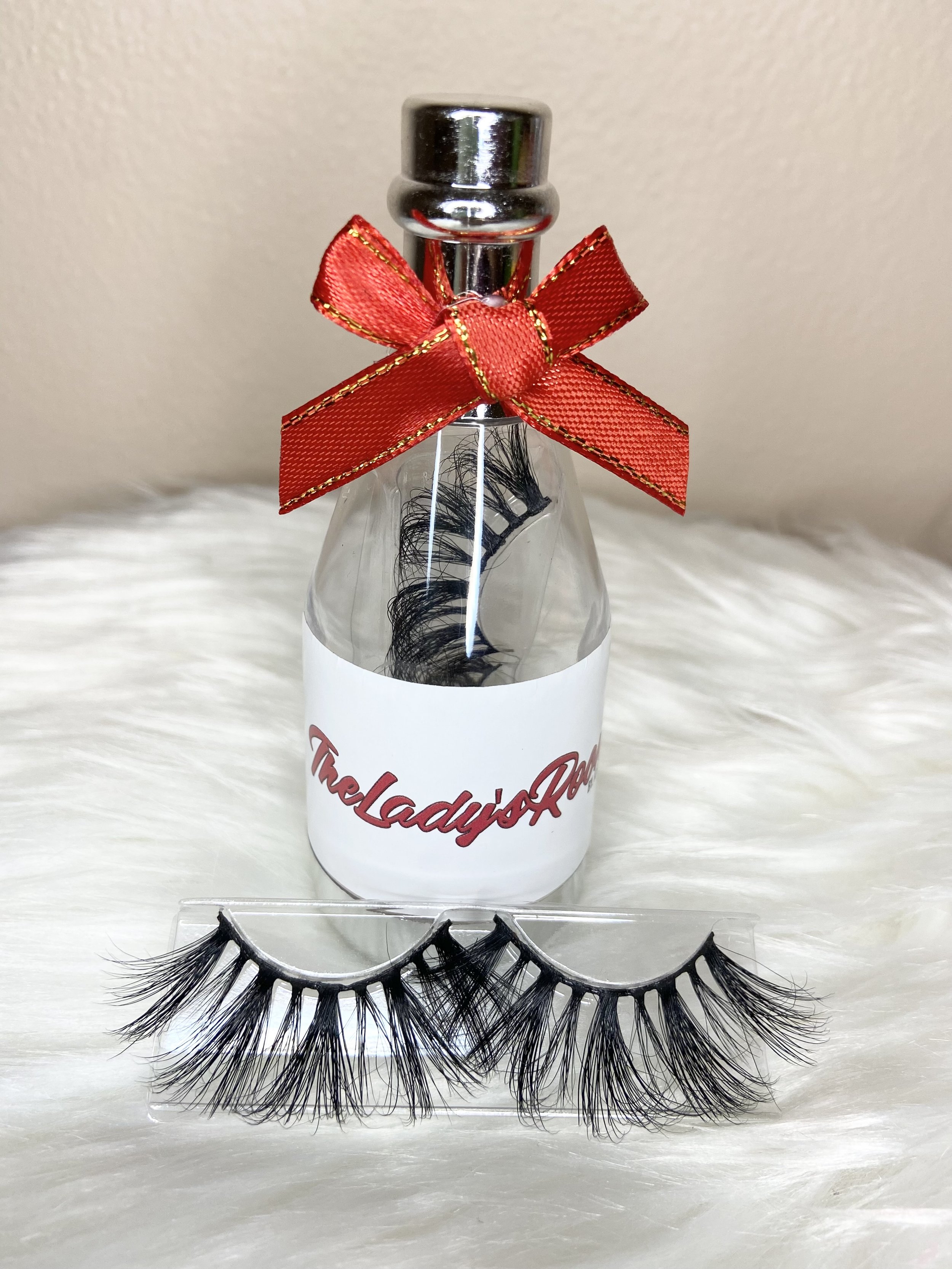 fluffy dramatic eyelash strips in a wine bottle packaging