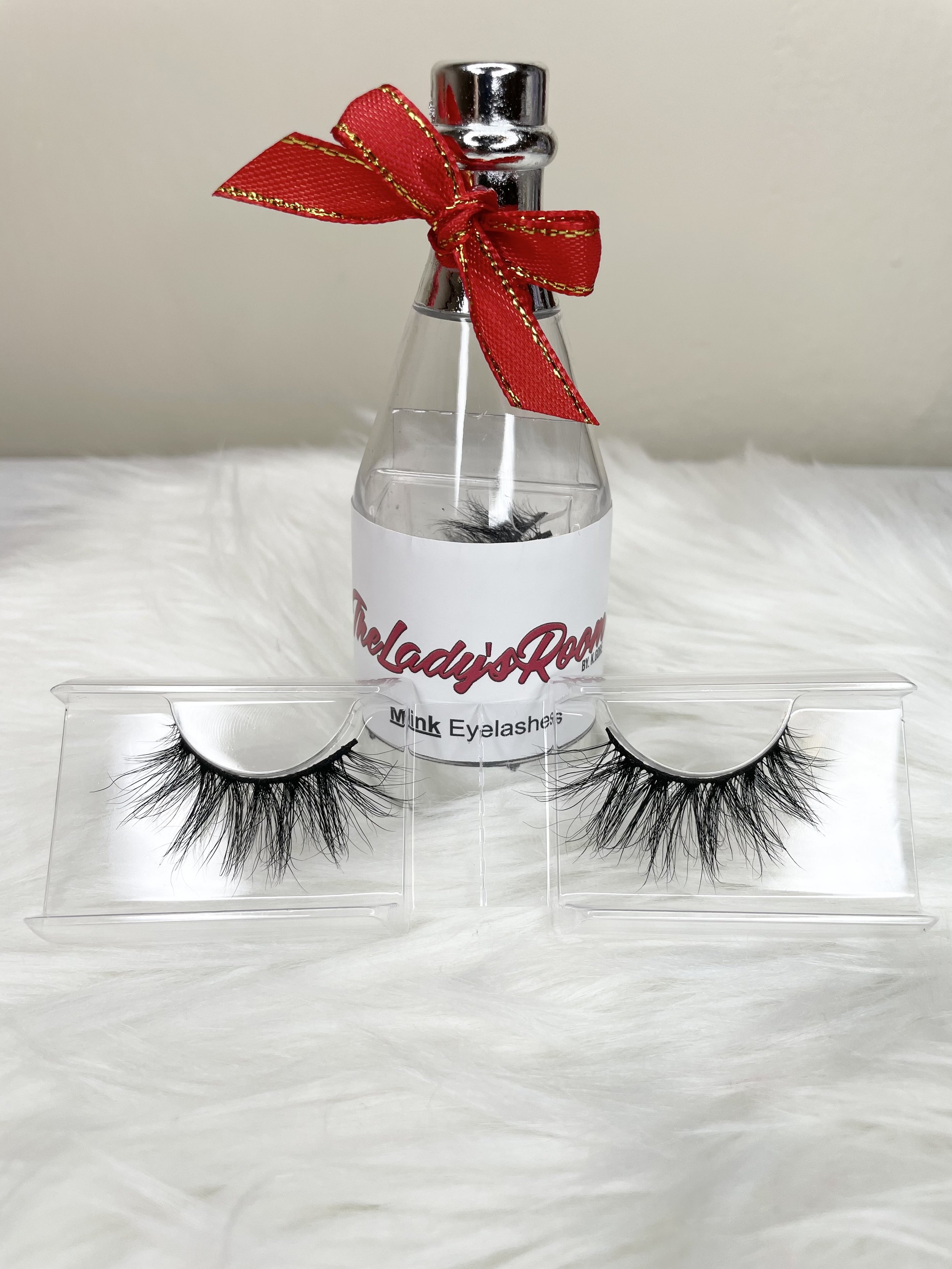 simple short eyelash strips in a wine bottle packaging