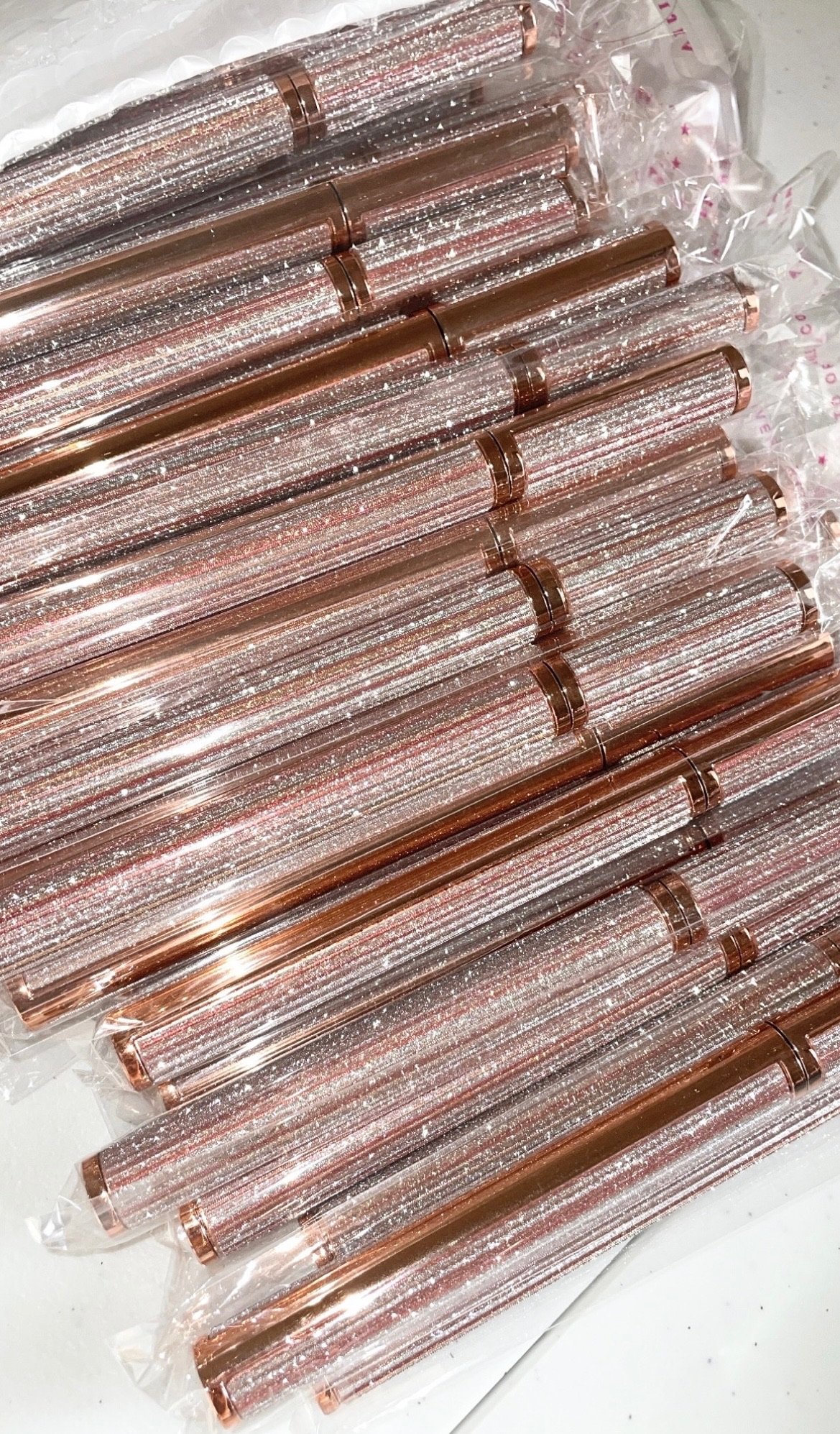 group of sparkly eyelash glue pens