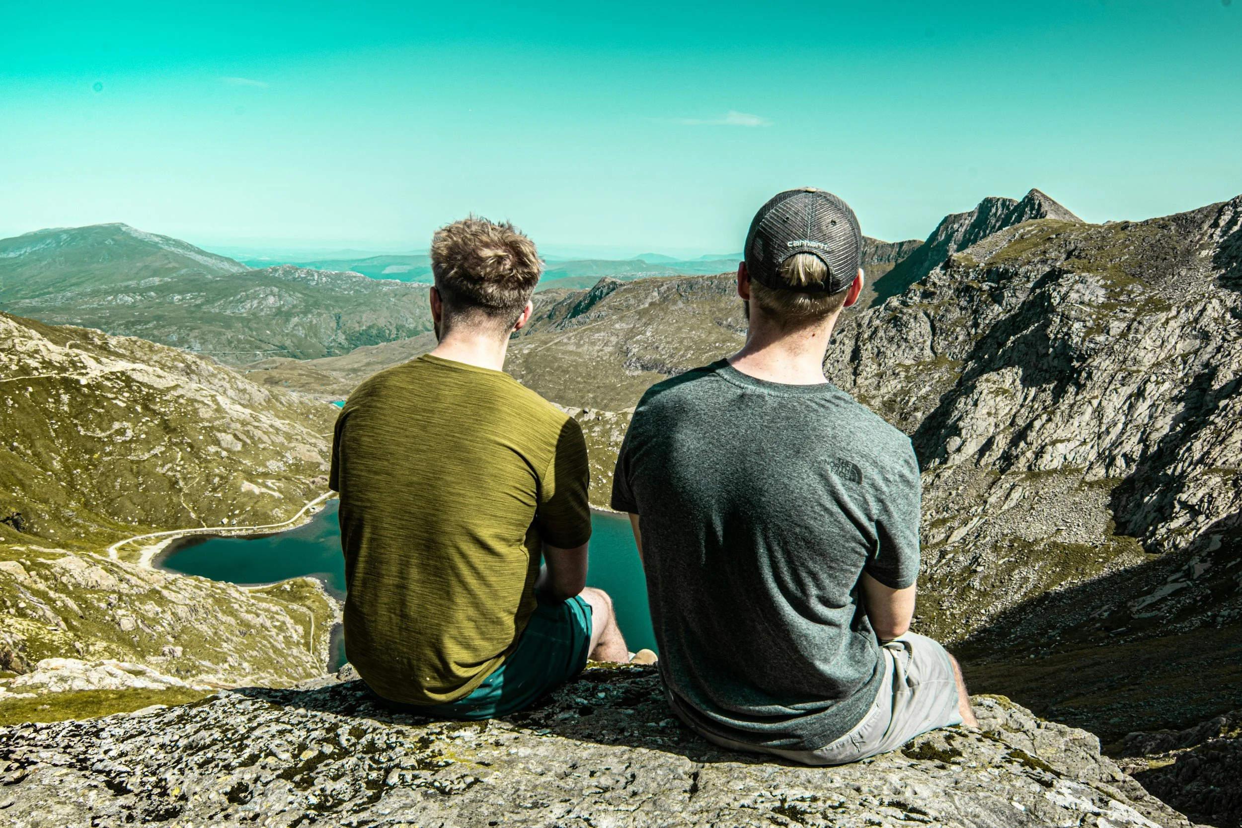 Two men in recovery from substance use and addiction hiking in Arizona as a part of their treatment.