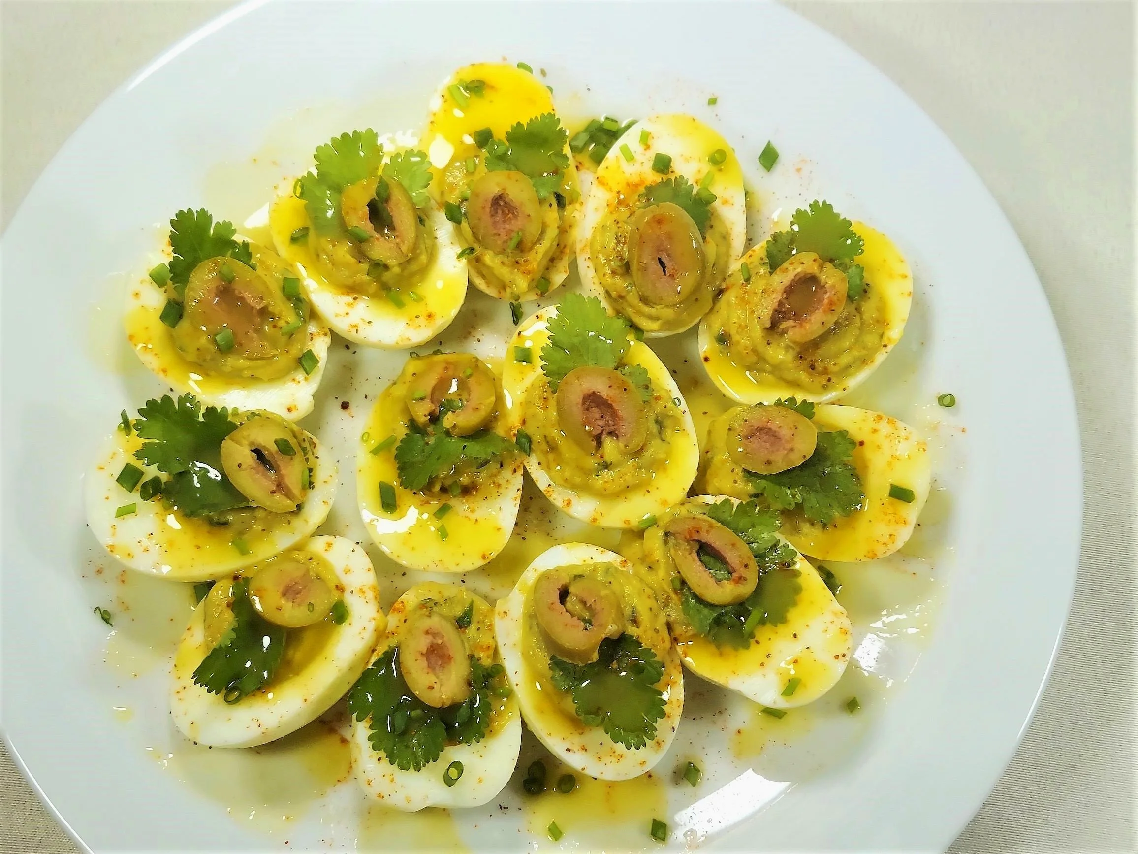 Spring Deviled Eggs flavored with seasonal spring toppings on a plate