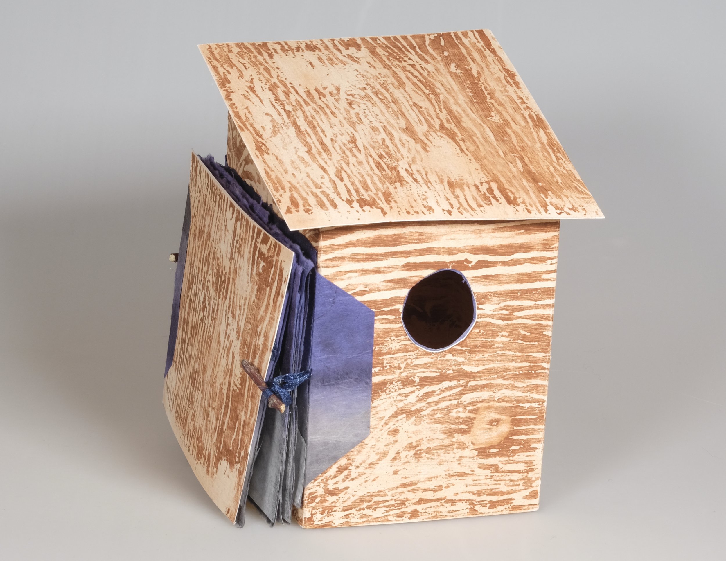 Bighorn Mountain Views, 3D Accordion Book (closed book), Woodblock print, handmade paper & graphite, 5” x 4” x 4” Birdhouse sculpture 4” x 29.5” accordion book, 2022