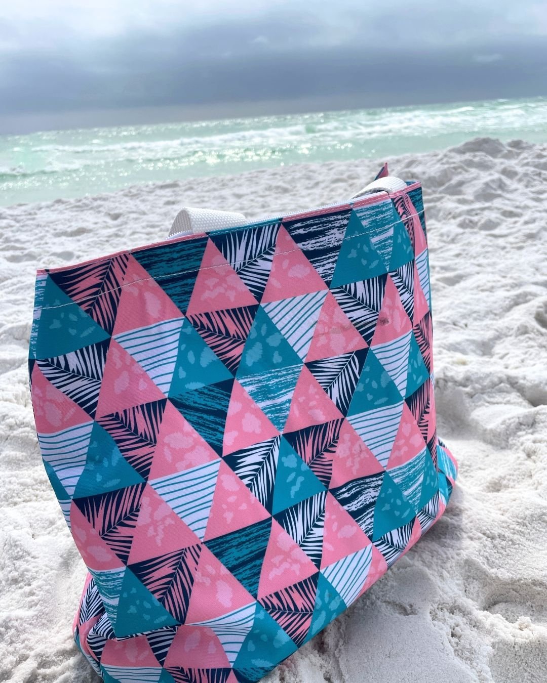 Looking for the ultimate summer accessory? Our lightweight and packable beach tote is perfect for the pool, beach, and travel. Made from recycled polyester, this eco-friendly tote can be fully customized on the outside to match your style. Inside, yo