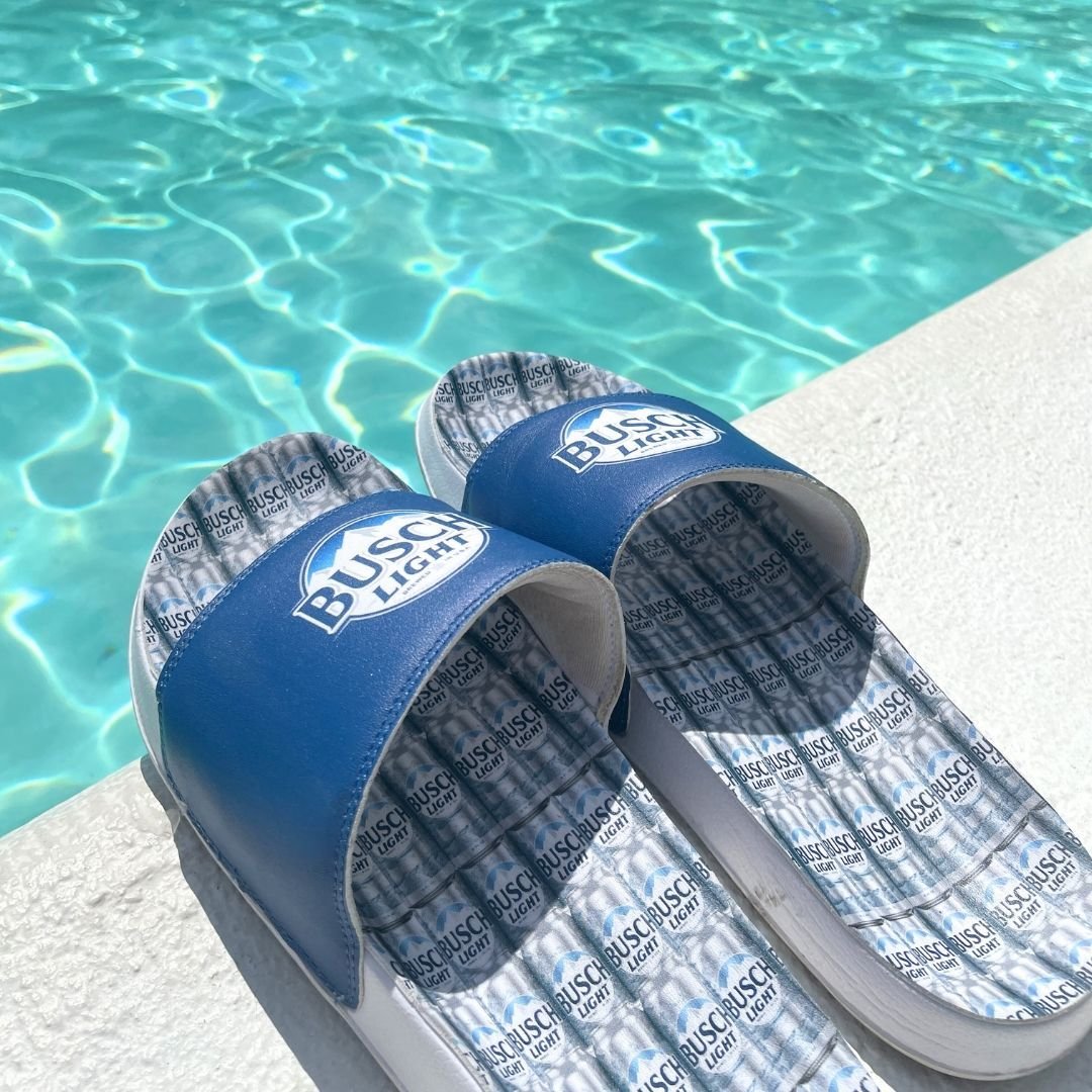 Step into summer with our sporty slides! With up to two customizable panels, these slides feature a printed microfiber leather upper and a lightweight, flexible EVA sole. Perfect for lounging by the pool, catching a sports game, or strolling on the b