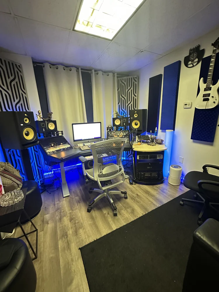 Control room at The Continental Studios with a mixing desk, KRK monitors and outboard racks