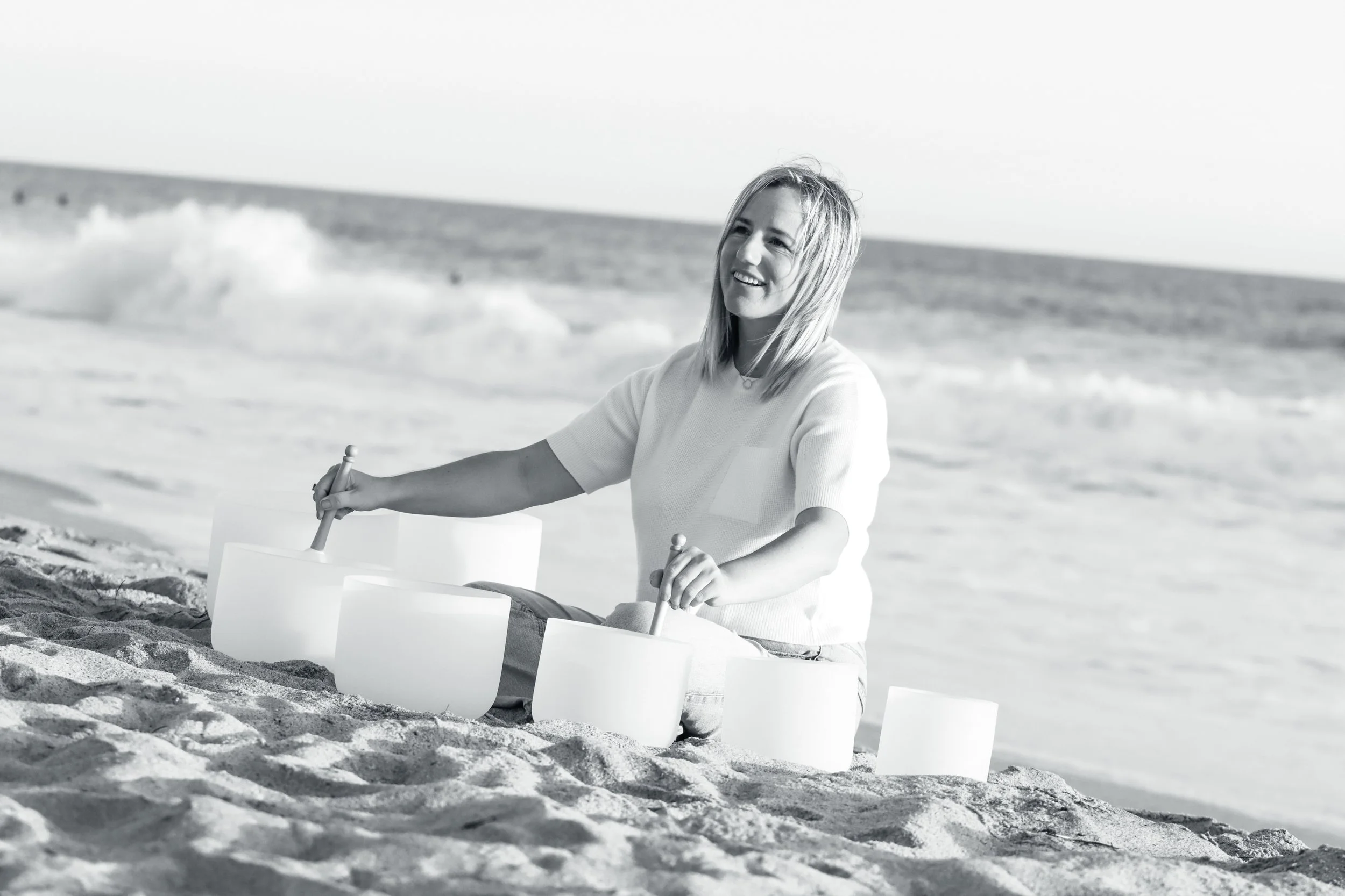 Sound bath at the beach in black and white.jpg