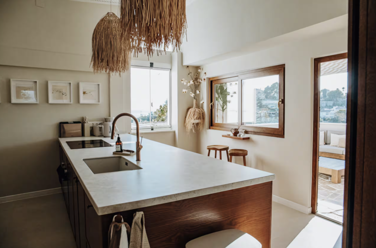 boho kitchen with white countertops and natural light.png