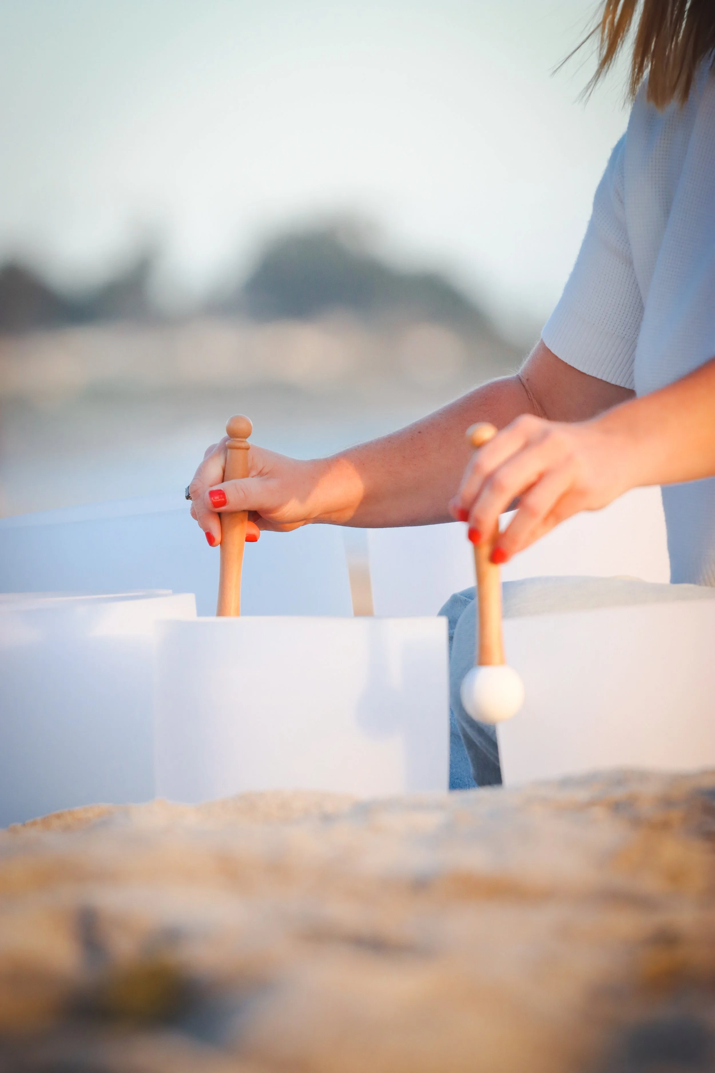Hands Playing Sound Bowls.jpg