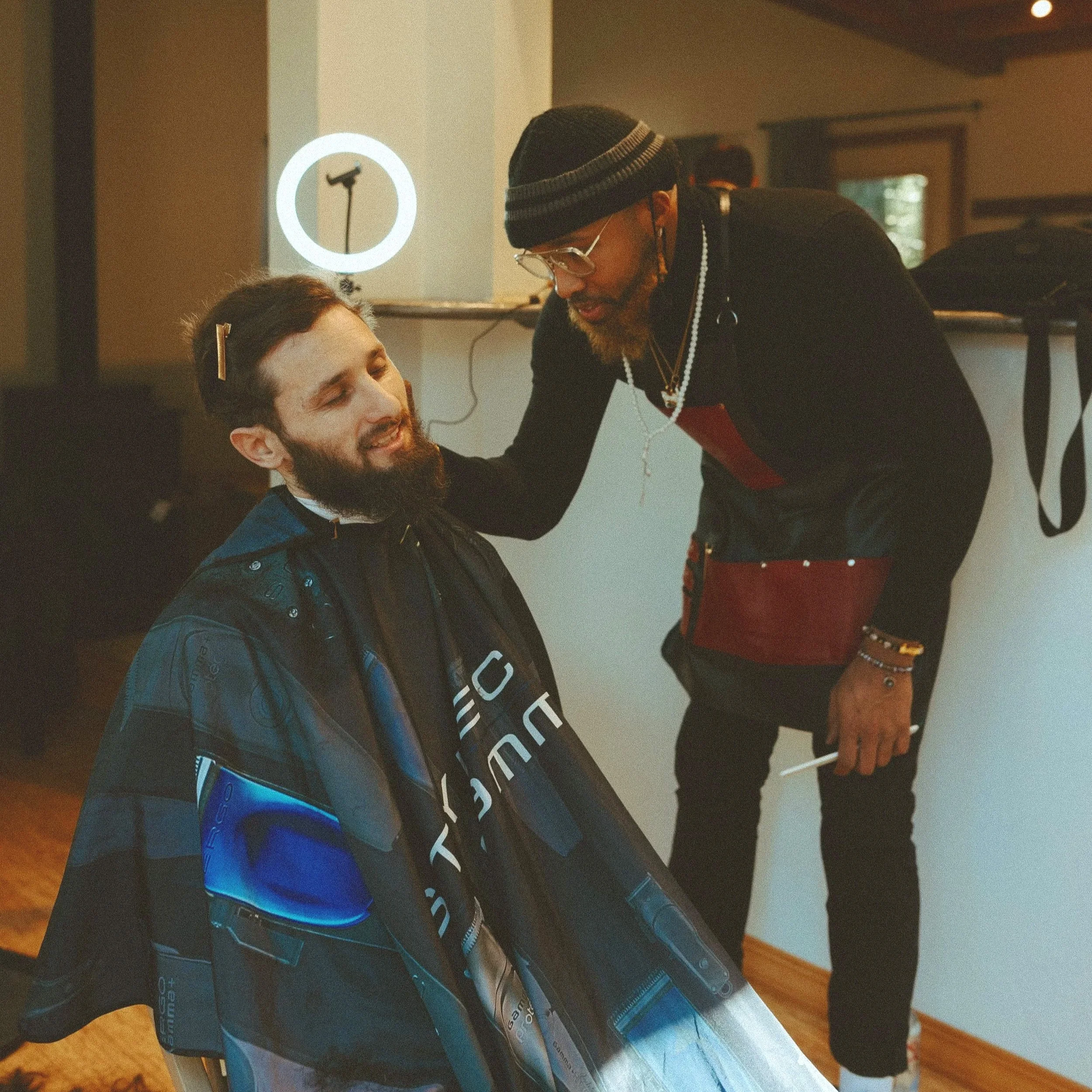 Groom receiving on-location grooming services on wedding day