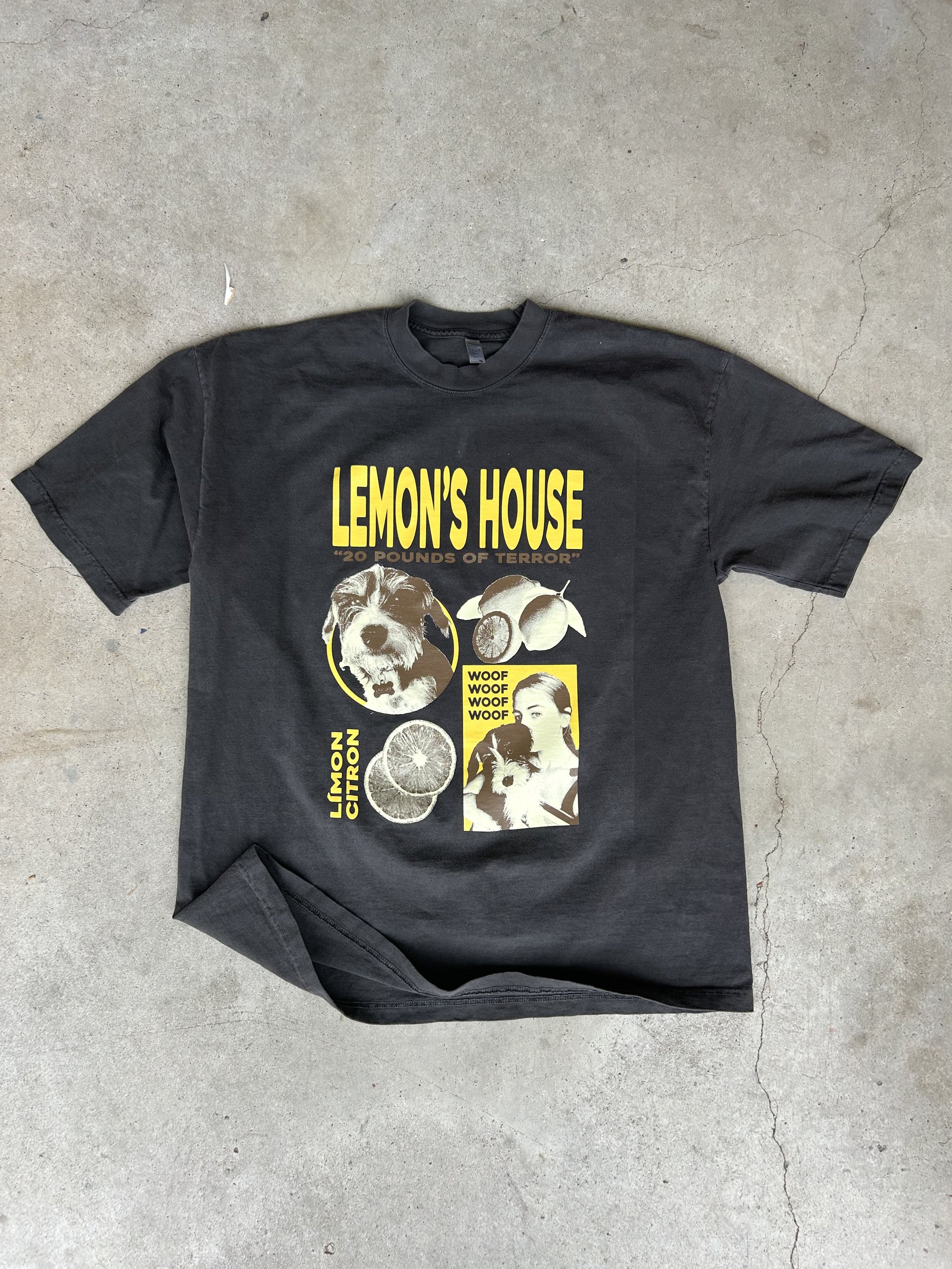 Black T-shirt with "Lemon's House: 20 Pounds of Terror" text, featuring images of a dog, slices of lemon, and a person.
