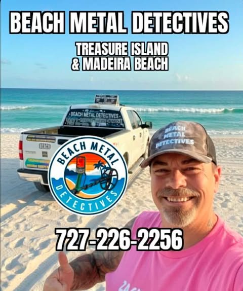 A man at the beach taking a selfie with a pickup truck and ocean in the background. The truck has a logo for Beach Metal Detectives, and the man is wearing a hat with the same logo. Text indicates the location as Treasure Island and Madeira Beach, and includes a contact phone number.
