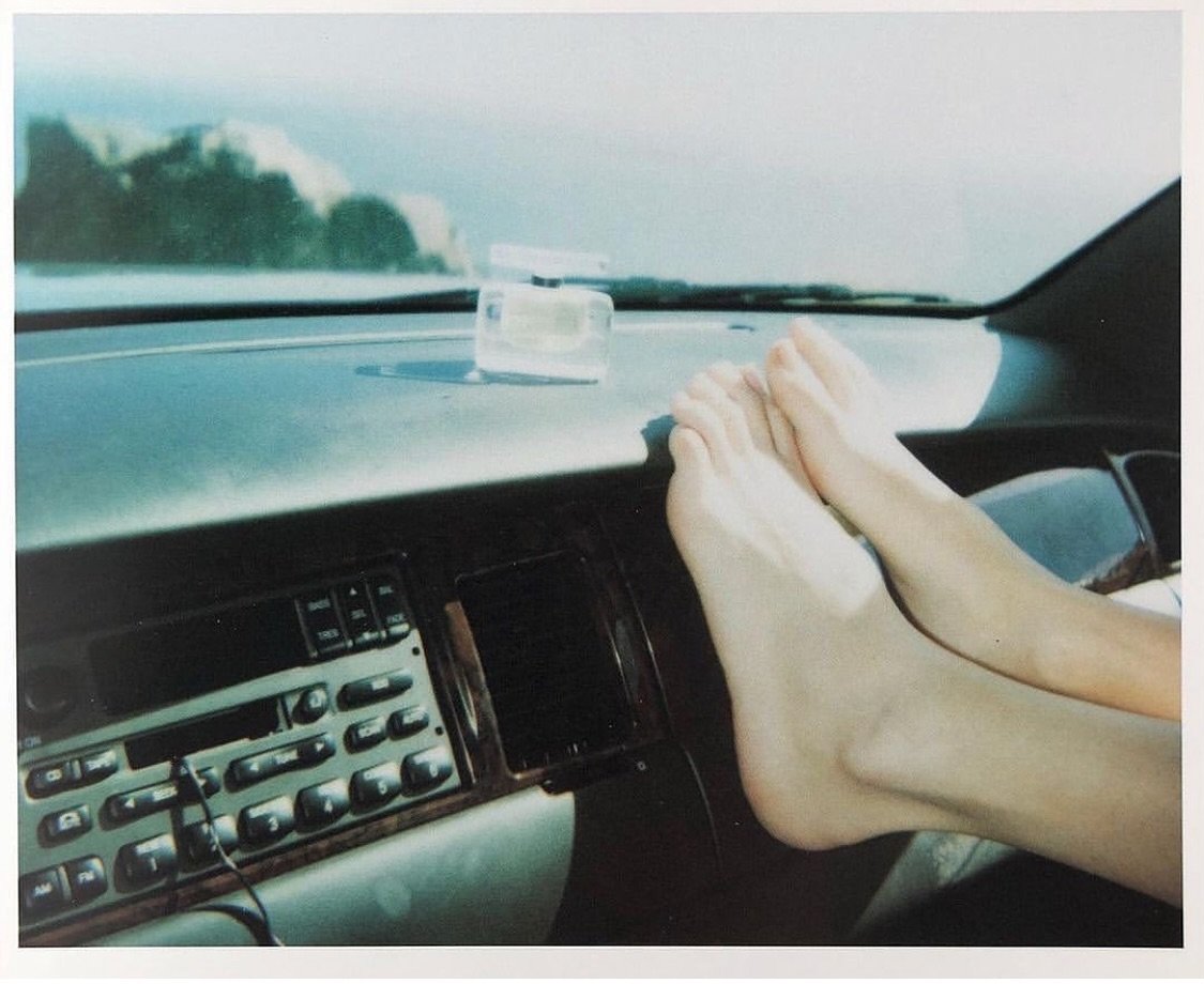 Bare feet on a warm dashboard, gazing out of the window while your favourite song plays ☁️🤍

&mdash;&mdash; the feeling of reflexology.

Sofia Coppola by Juergen Teller.