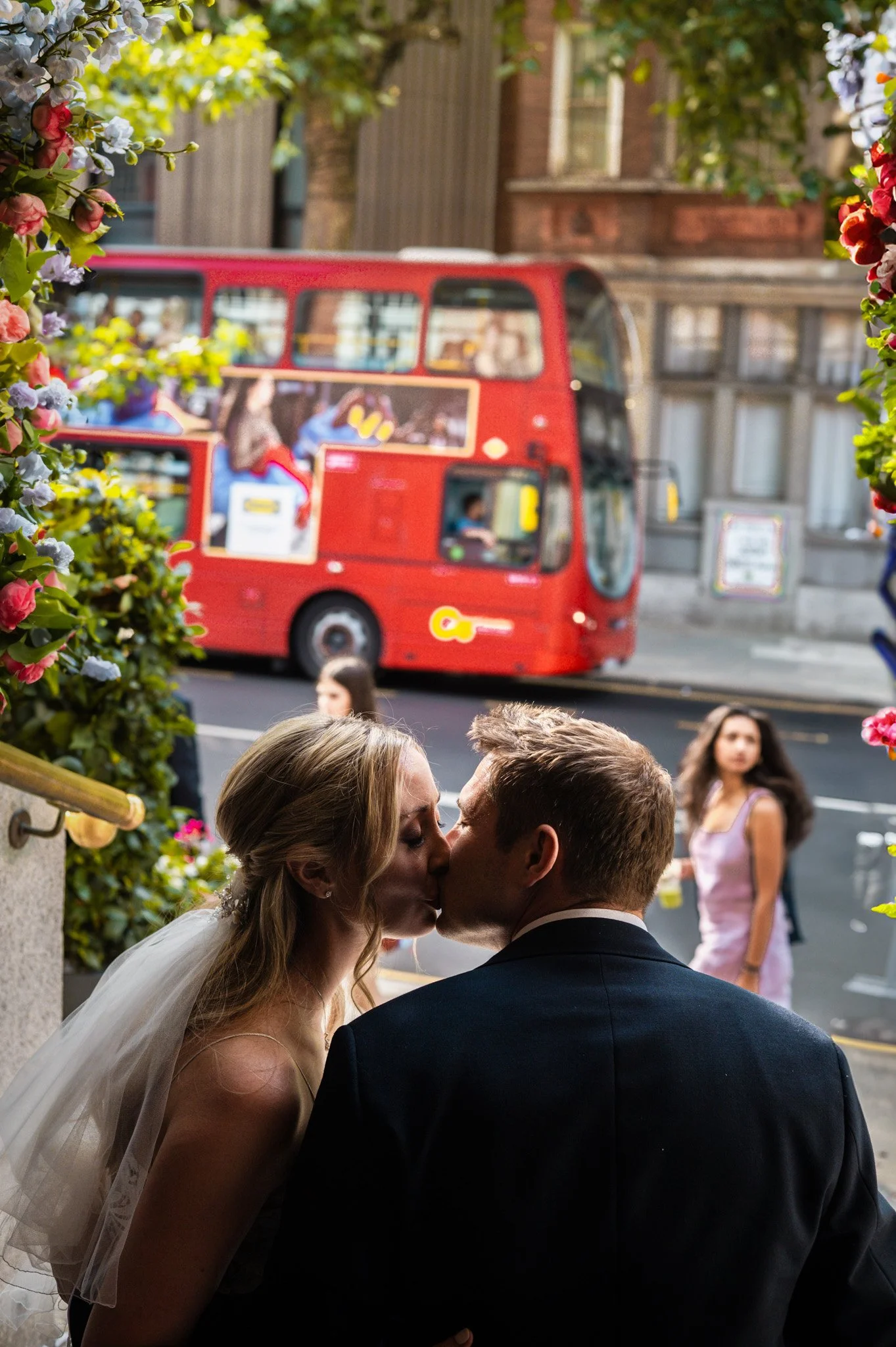 Newly married couple sharing a quiet moment together in the city after their ceremony. I am a wedding photographer based in Peterborough, Cambridgeshire, specialising in relaxed, authentic wedding photography.
