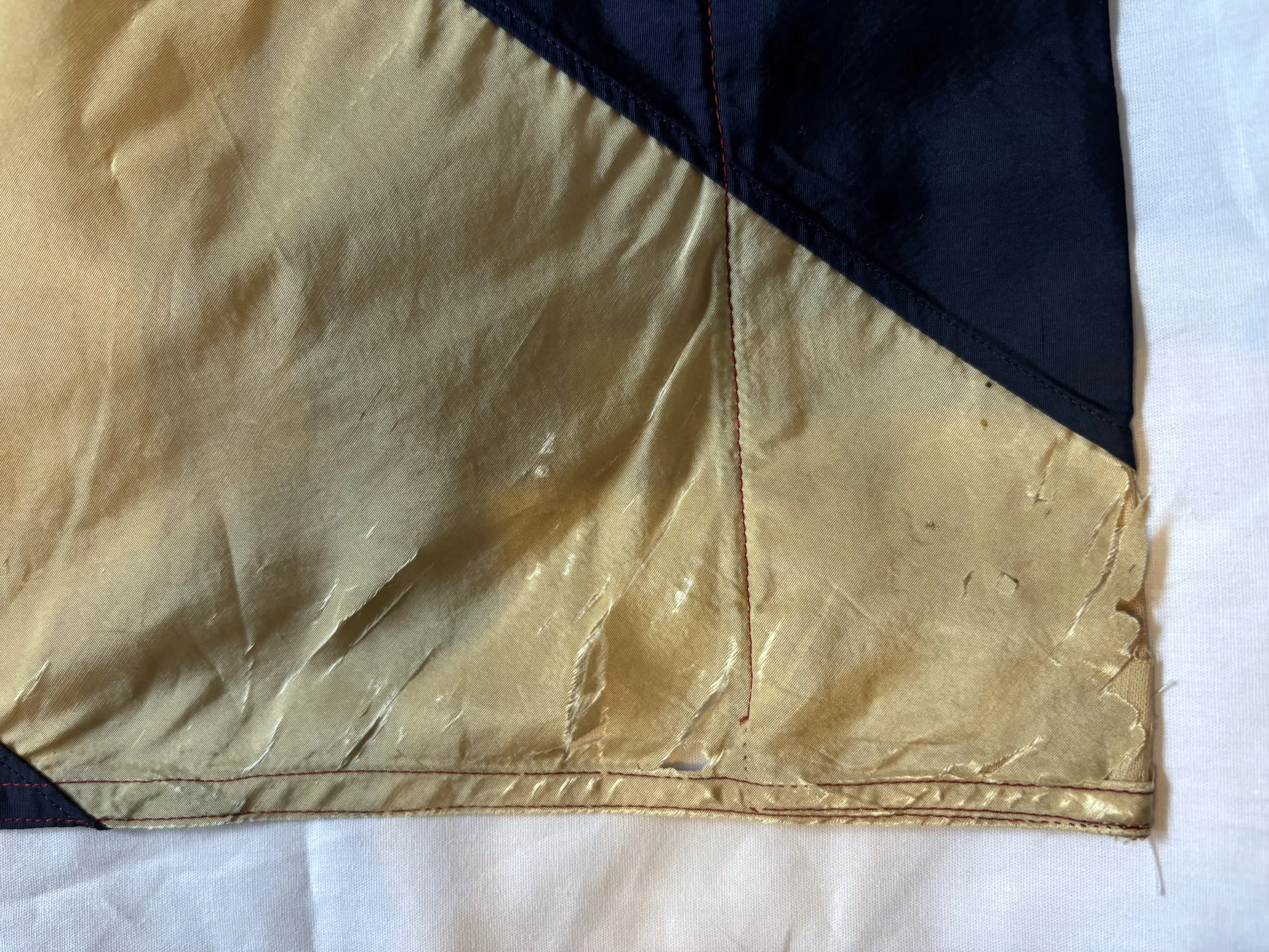 Corner where both large and tiny tears can be seen