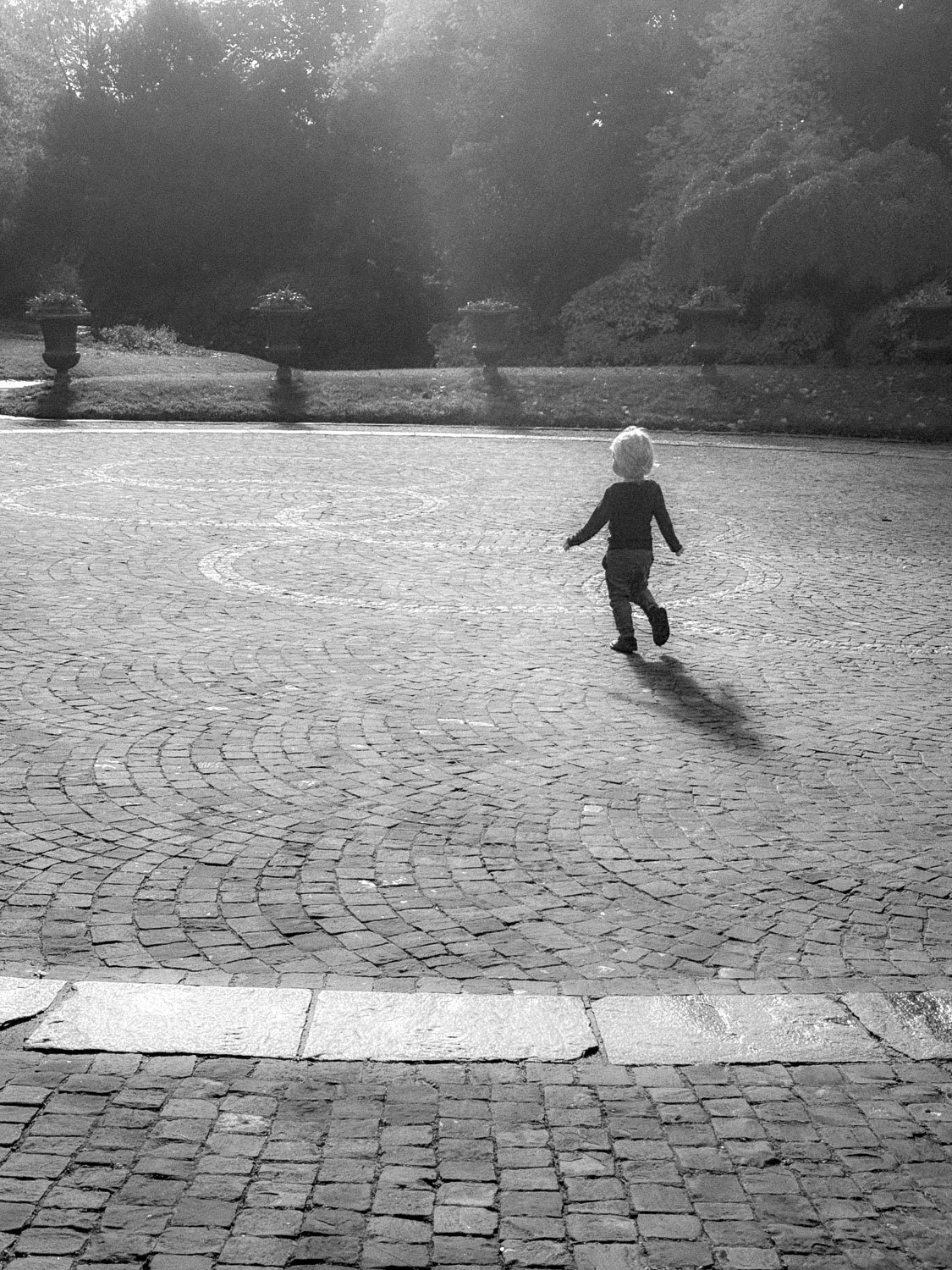Boy running toward the sun, Parc Mon Repos, Lausanne, 2025