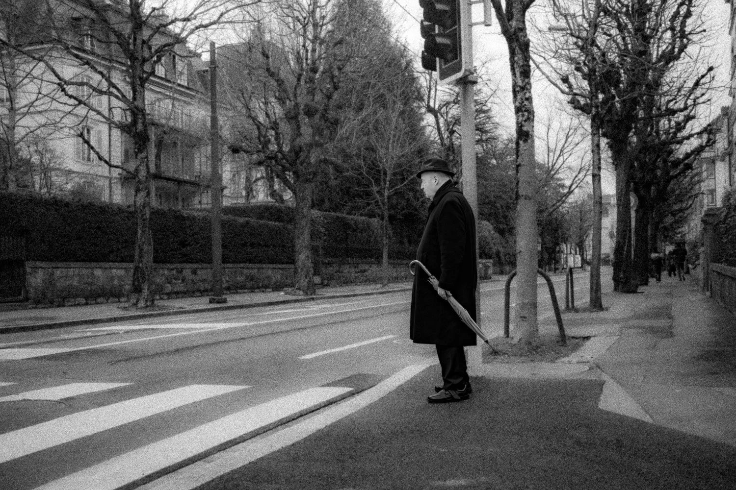Man standing on Avenue de Rumine, Lausanne, 2024