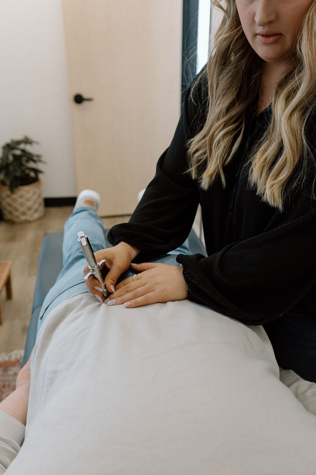 Dr. Jules adjusting a patient at  aNew Health