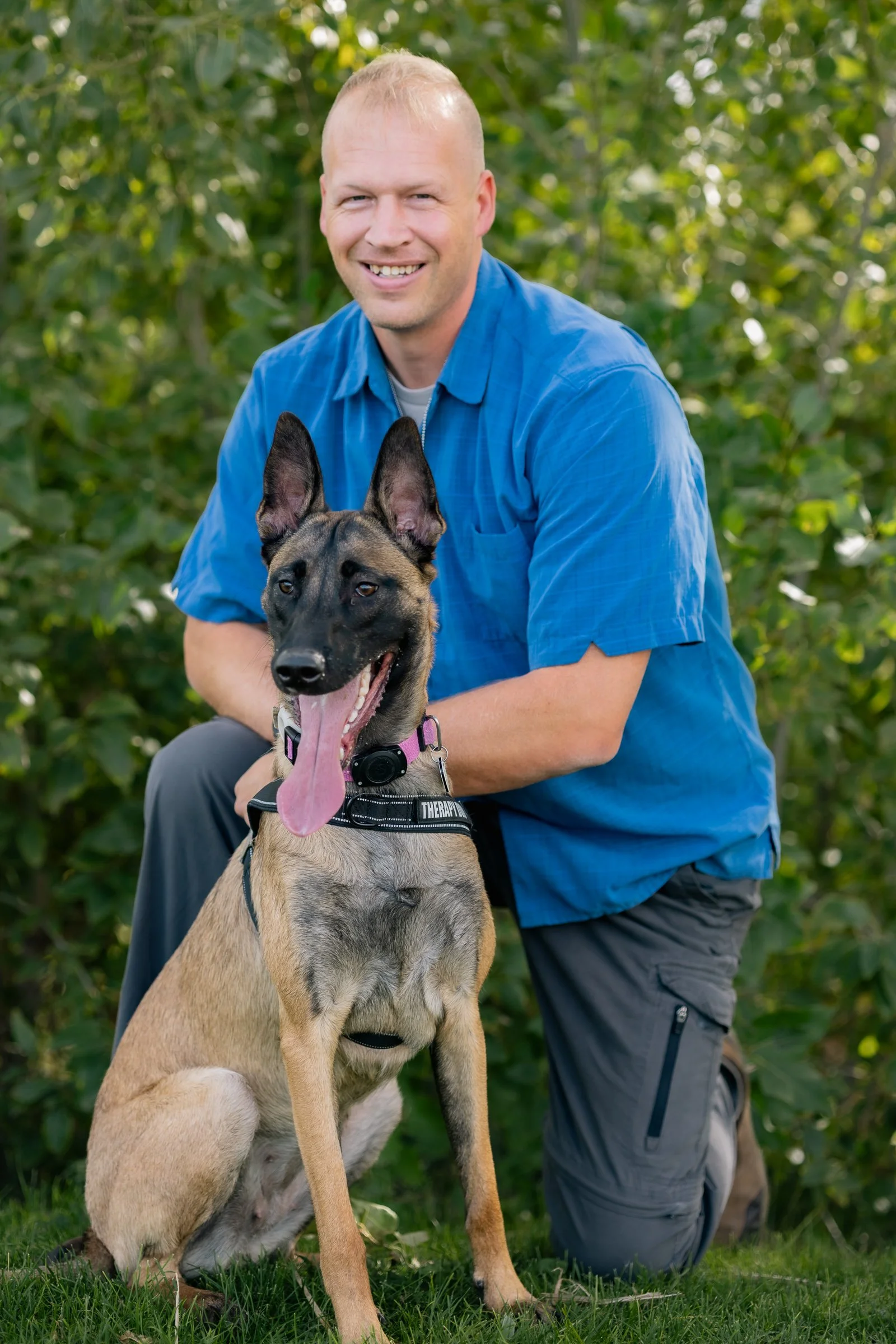 Nathan Pond, licensed mental health therapist, with his therapy dog in training