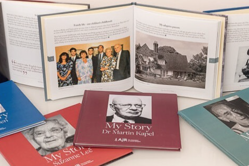Books on a shelf showing interior and cover pages