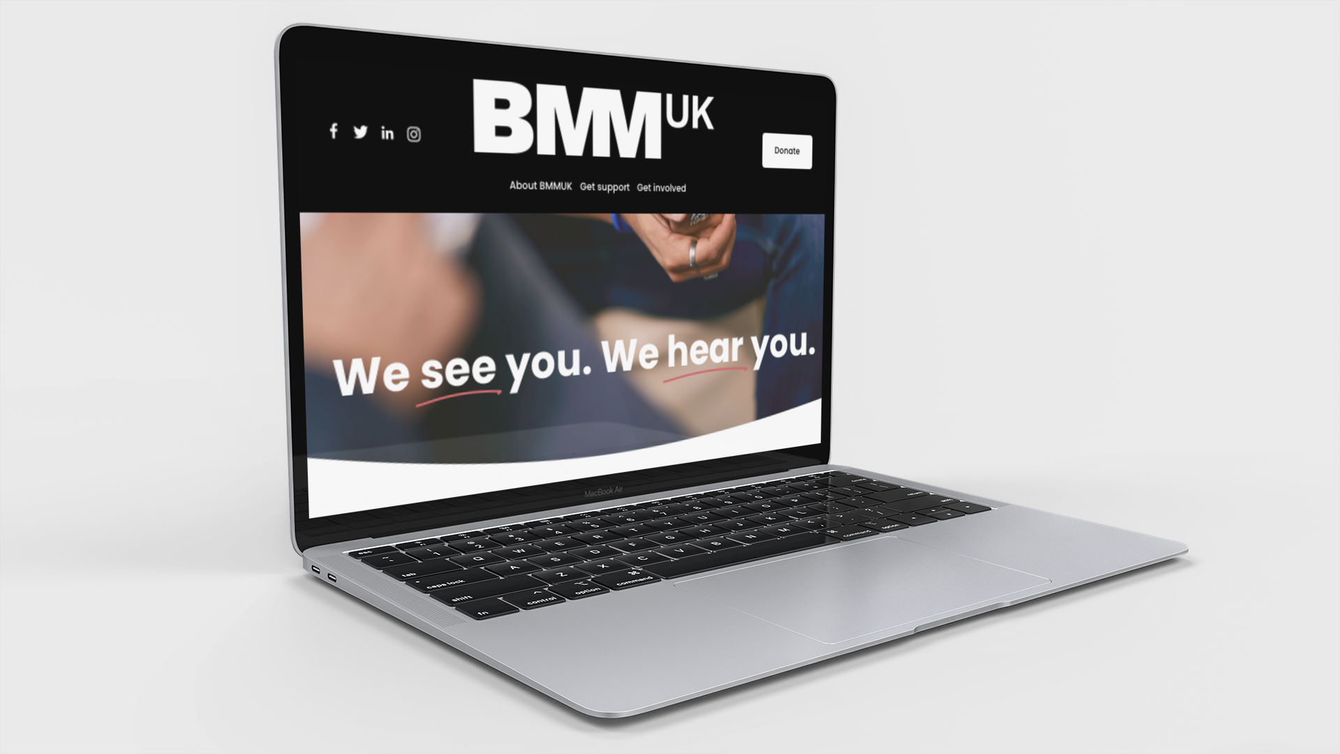 Macbook open showing a website on the screen