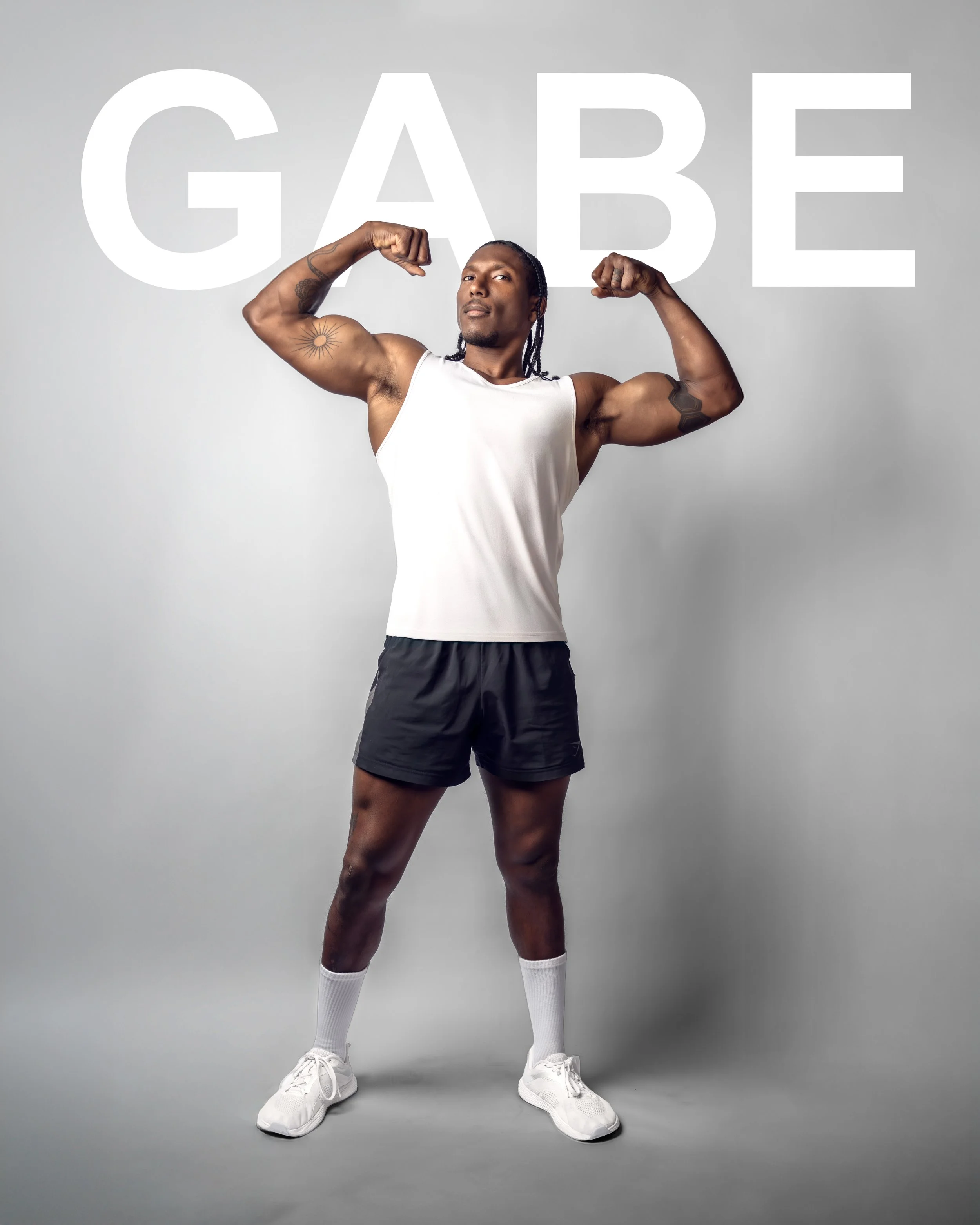 ATLANTA FITNESS PHOTOGRAPHY SESSION FEATURING ATHLETE POSING IN STRONG GYM PORTRRAIT