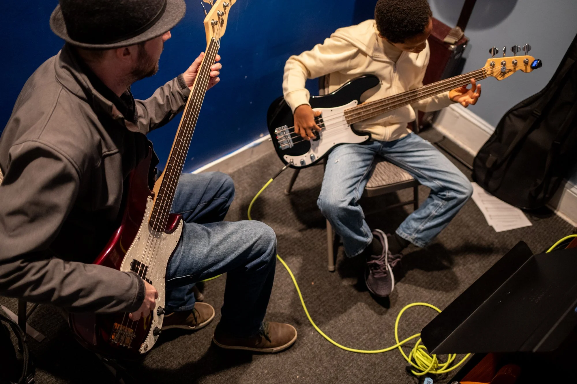 group of students learning ukelele