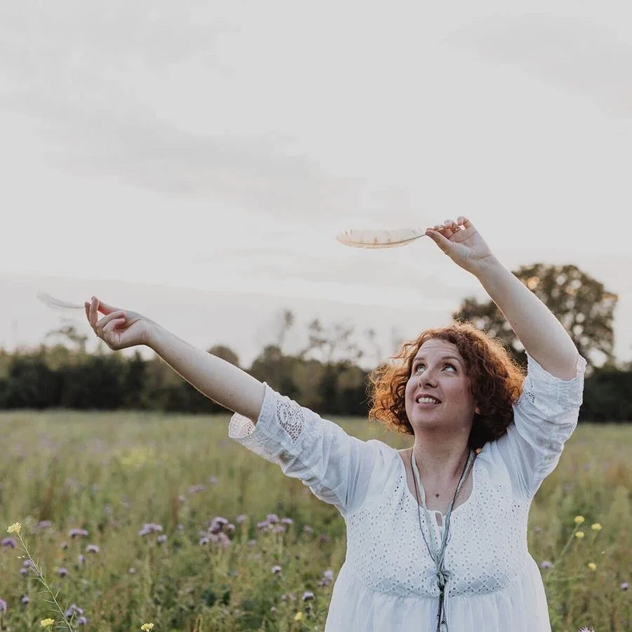 woman enjoying freedon in a wildflower field, inspired by nature and creativity