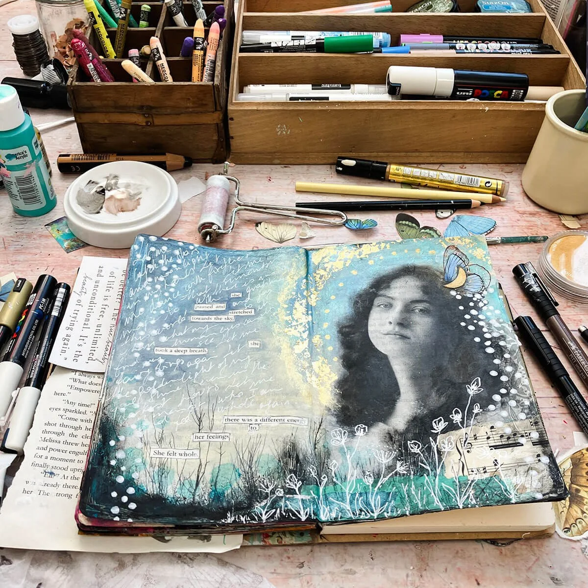 Mixed media art journal page with image transfer of a vintage photo portrait.