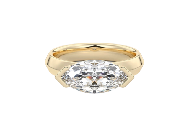 A gold ring with a large diamond solitaire on a black background.