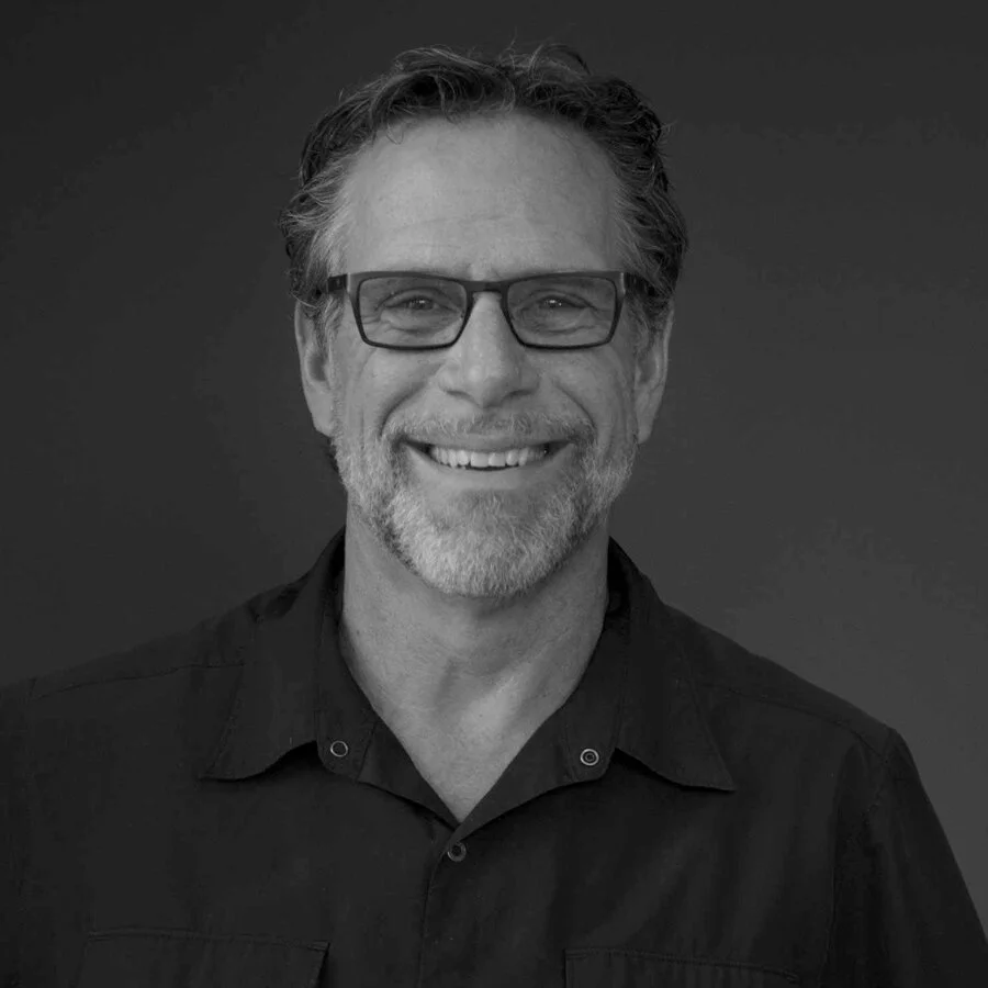 A portrait of Gord Klassen in black and white