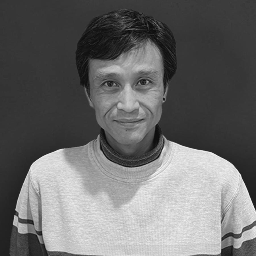 A portrait of Andrew Wang in black and white