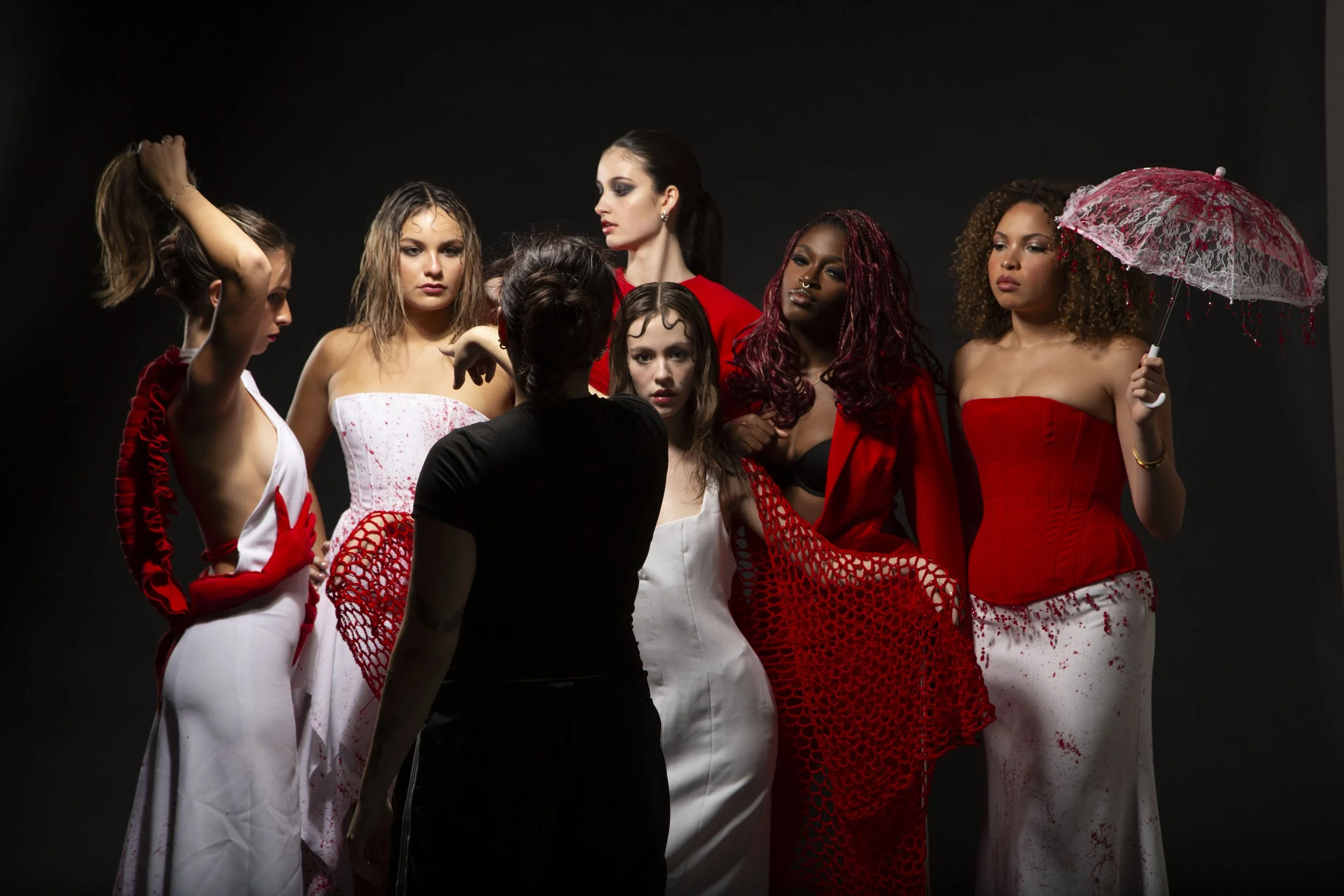 13.	Layla assembles her looks for the final group picture of her senior collection. After 5 years at Syracuse University, this photoshoot marked the final requirement for her academic career.