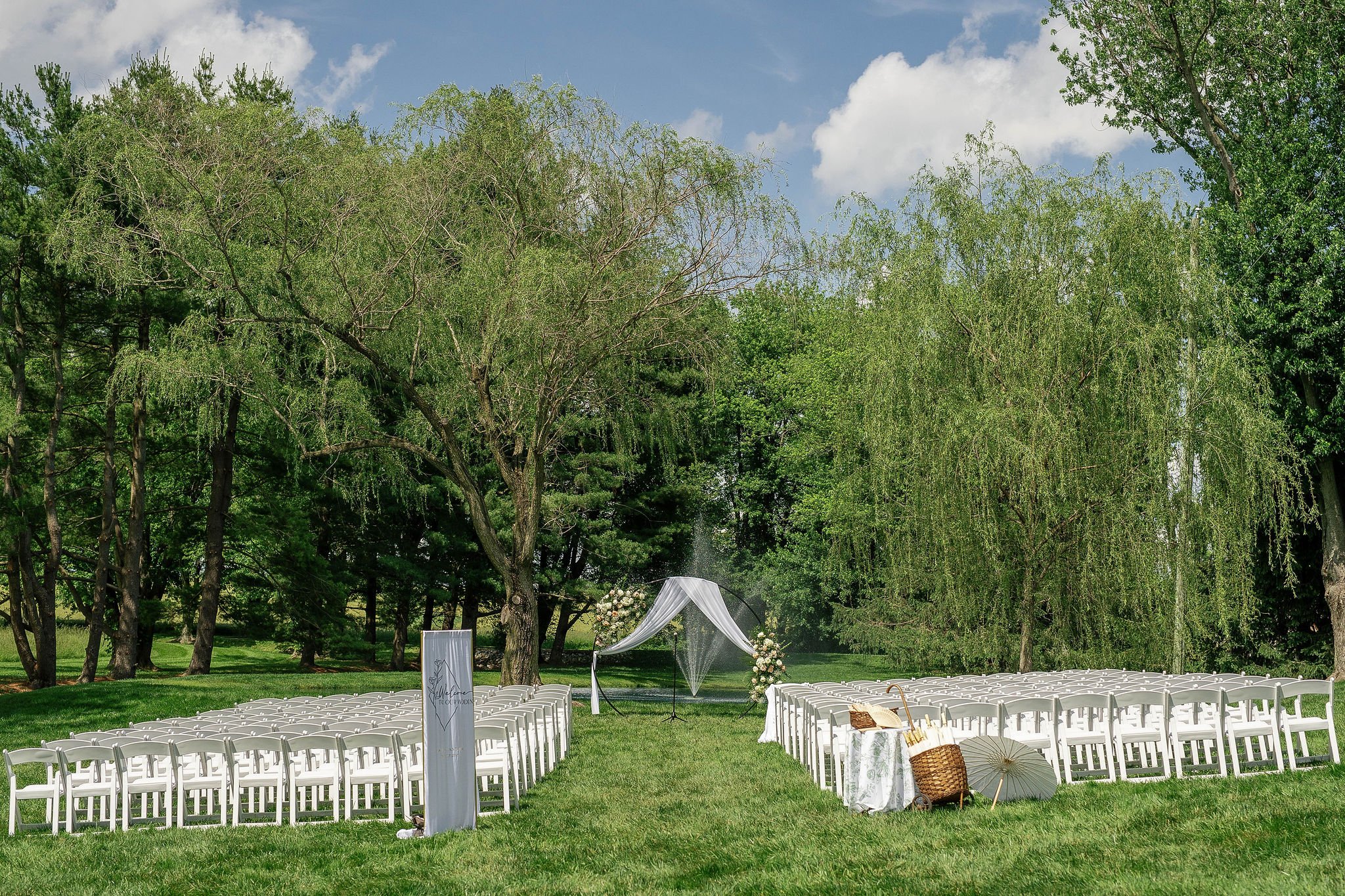 Outdoor wedding ceremony with pond