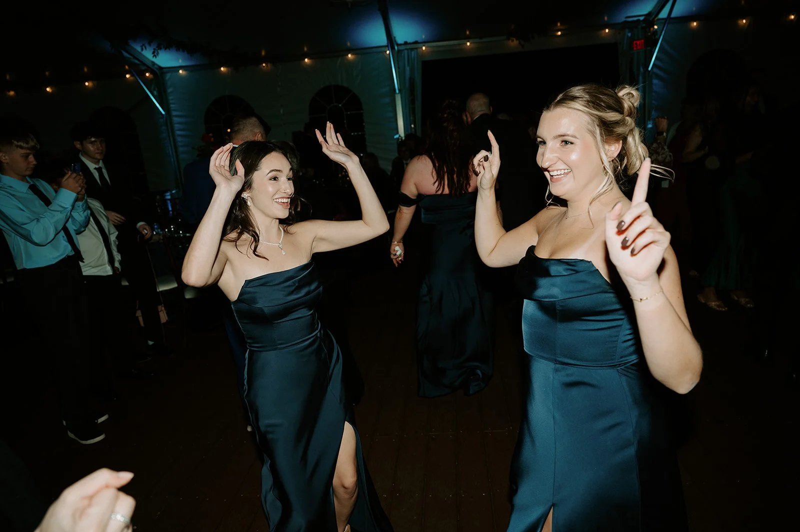 celebrating in outdoor reception tent