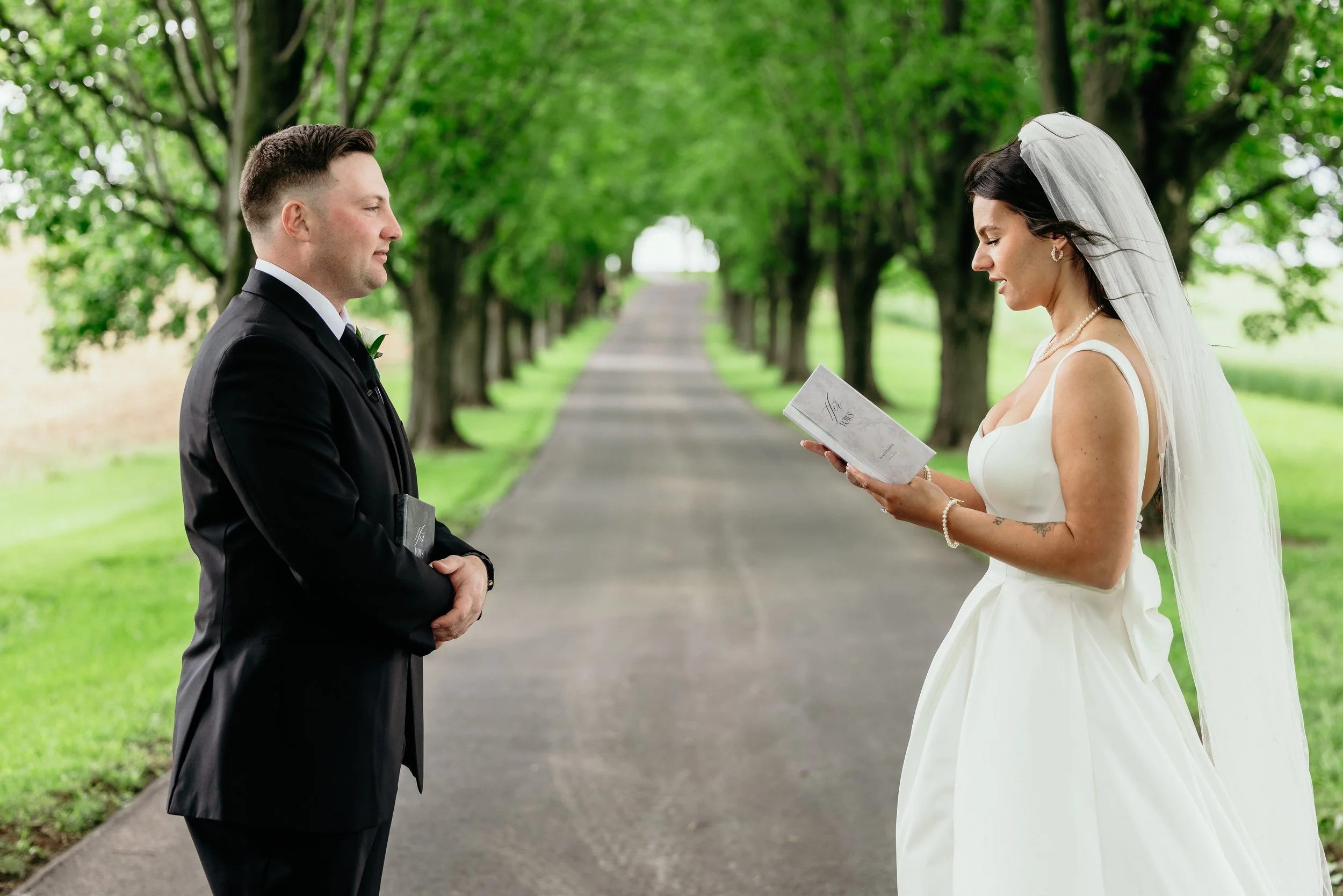 Private vows under a tree lined driveway