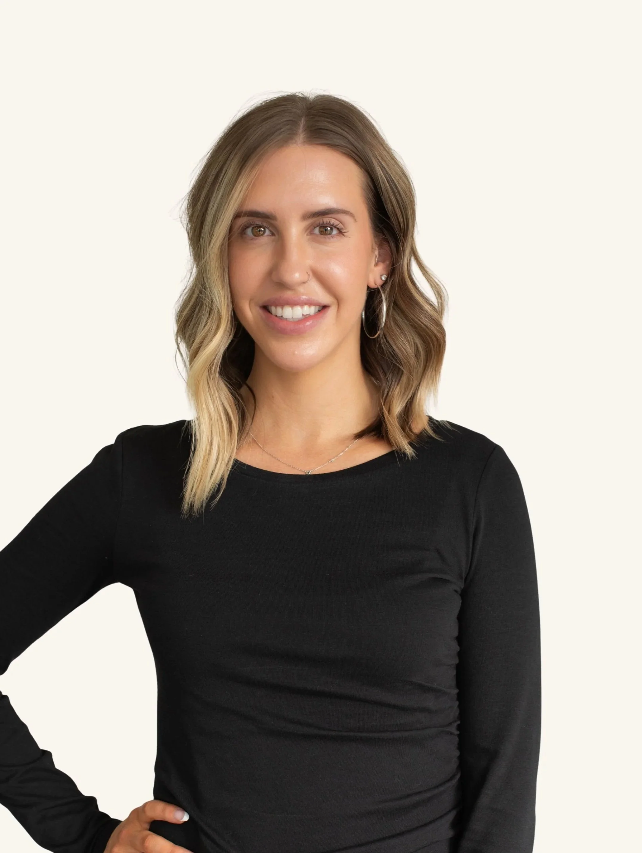 Kelly Belair, Certified Aesthetic Esthetician, Practice Manager,  and Portland, Oregon native. Smiling warmly and looking optimistic, patient, and kind.