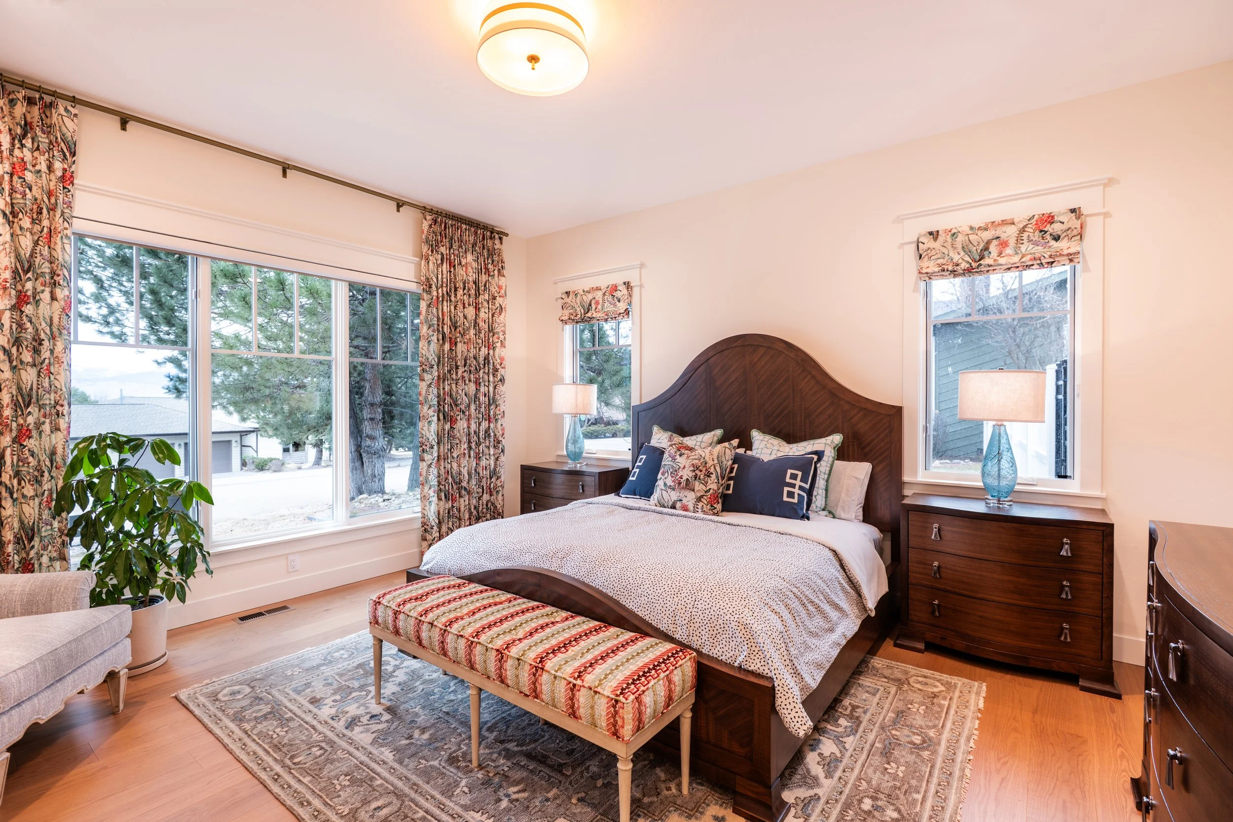 primary-bedroom-custom-design-home-builder-drapes-montana-missoula-oak-windows-plants.jpg