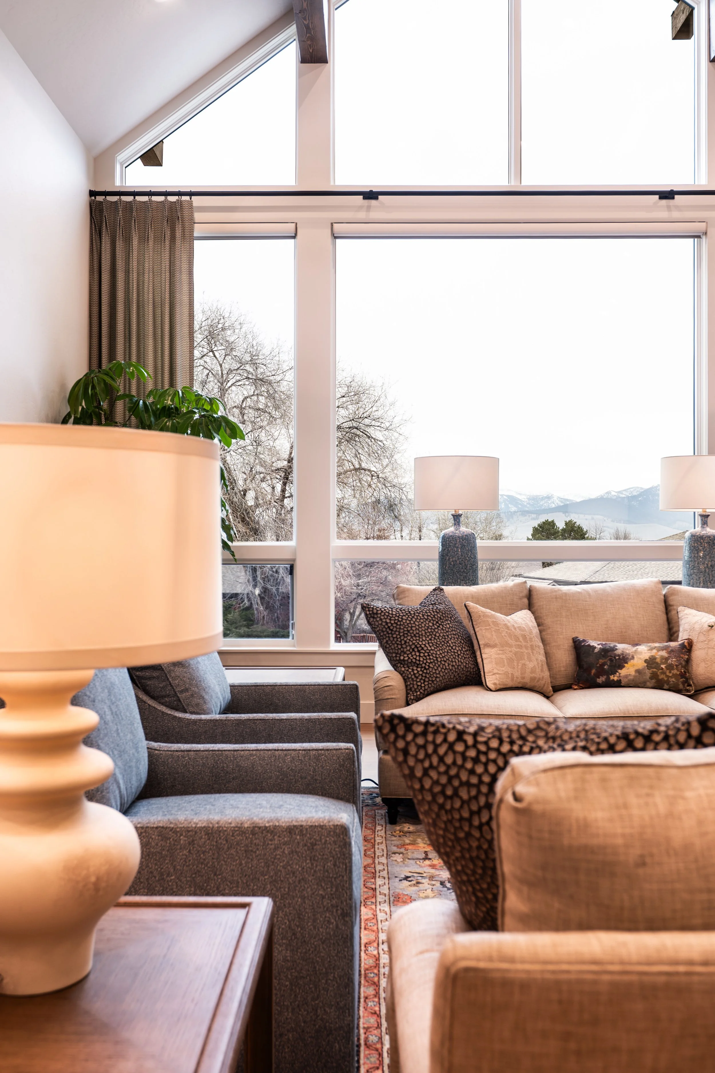 living room-window wall-custom-montana-design-plant-drapes-missoula-couch-art-builder-construction-fireplace-stone.jpg