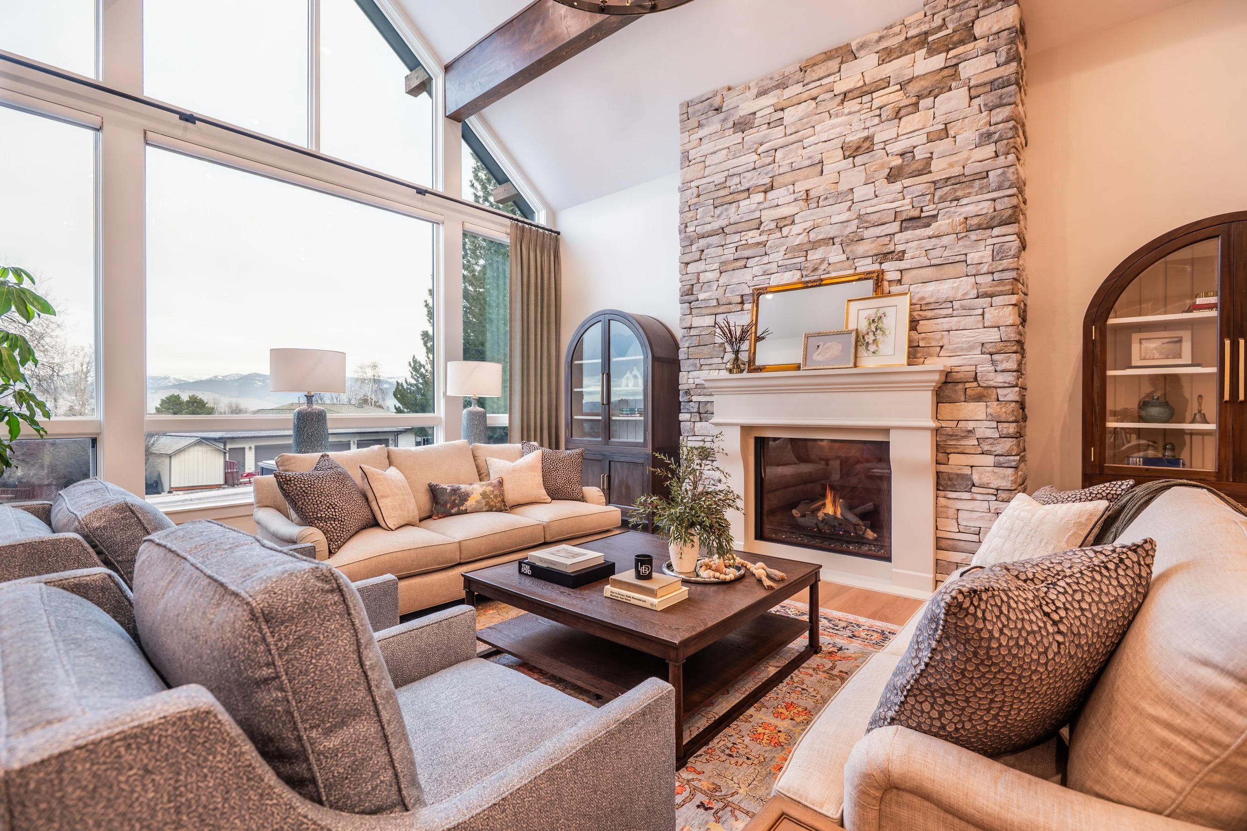 living room-window wall-custom-montana-design-plant-drapes-missoula-couch-art-builder-construction-fireplace-stone-bookshelf-mantel.jpg