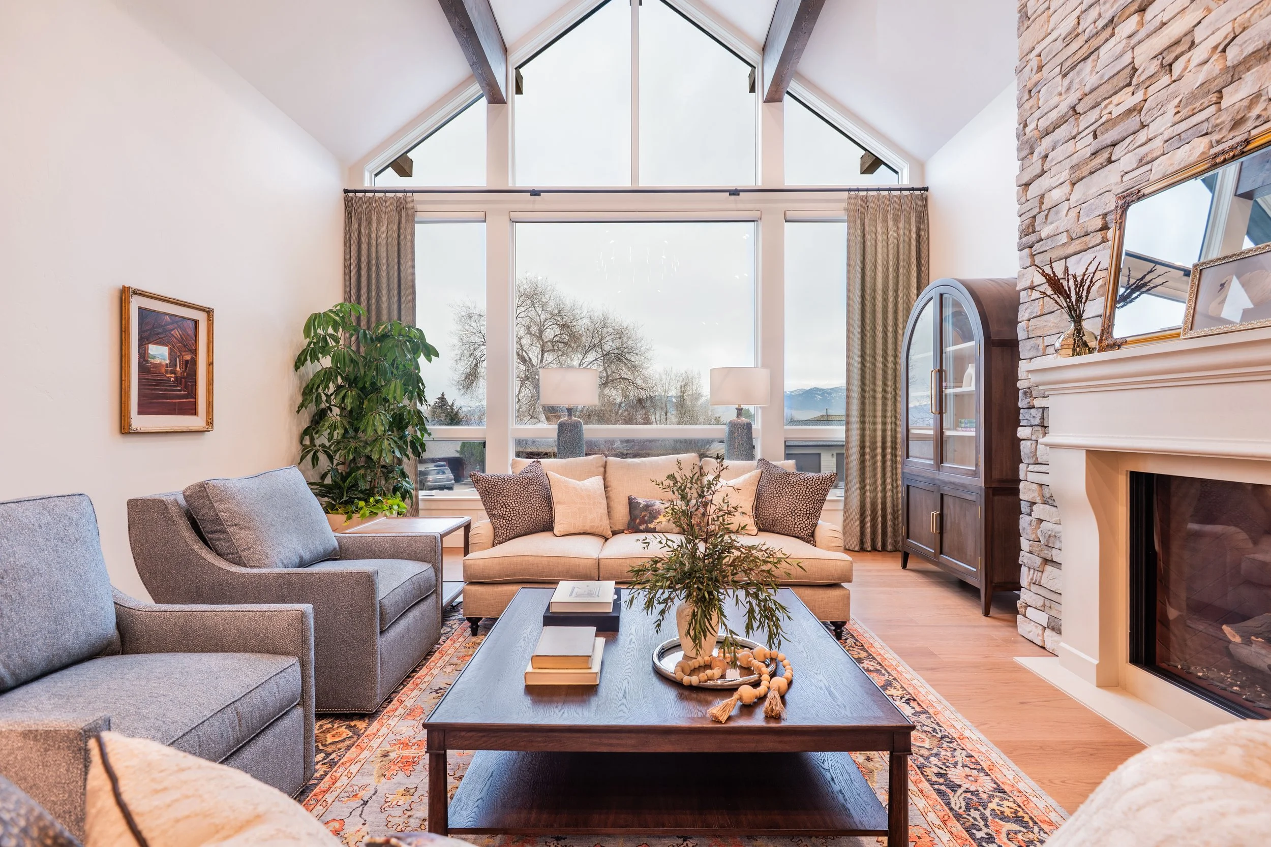 living room-window wall-custom-montana-design-plant-drapes-missoula-couch-art-builder-construction-fireplace-stone-bookshelf.jpg
