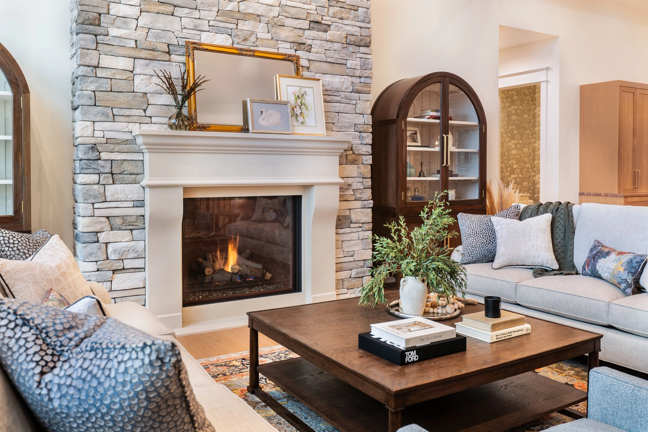 living room-window wall-custom-montana-design-plant-drapes-missoula-couch-art-builder-construction-fireplace-stone-bookshelf-mantel-coffee table.jpg