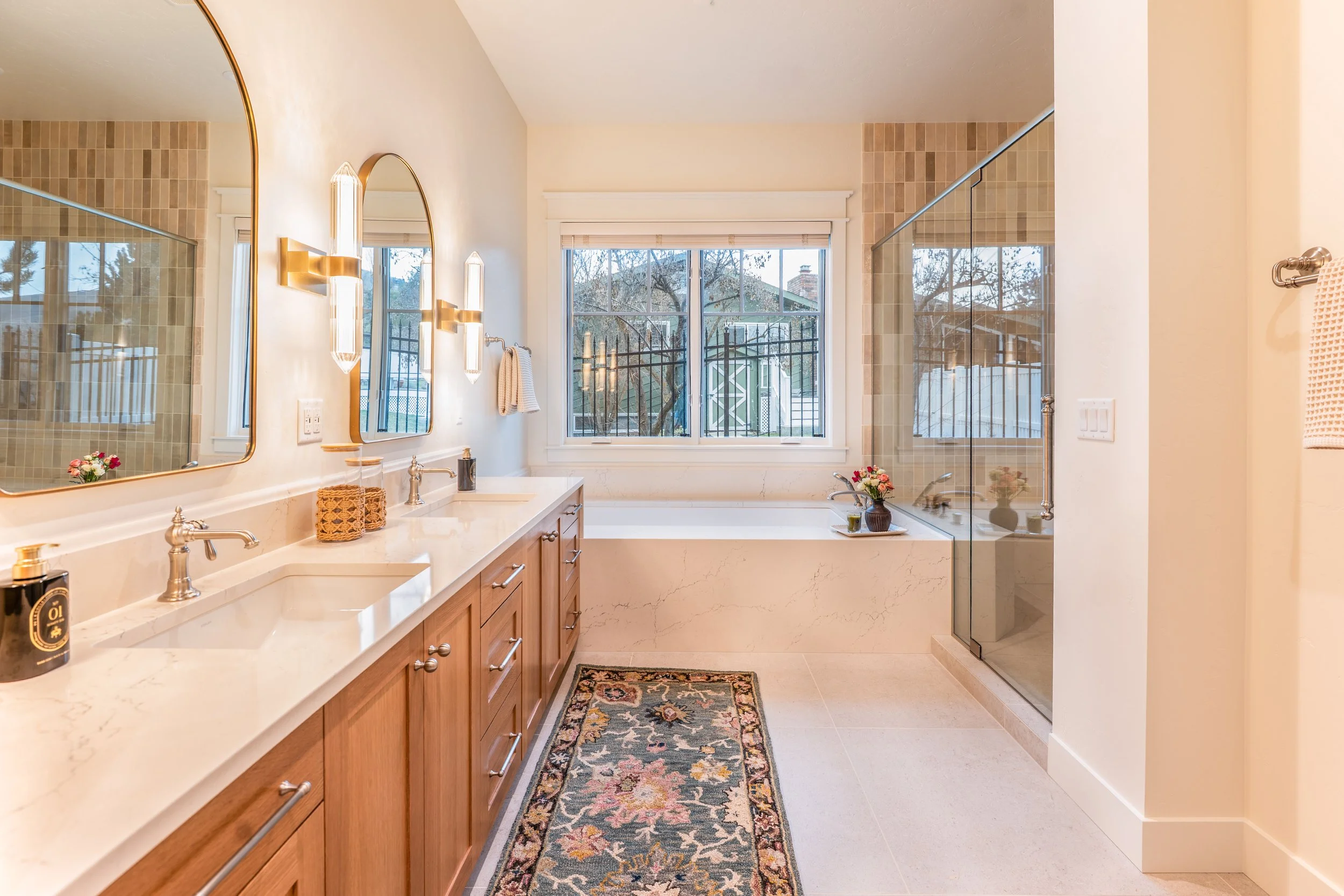 primary-bath-tile-custom-home-montana-missoula-shower-sink-quartz-countertop-brushed nickel-mirror-glass-bench-oak-cabinets-vanity.jpg