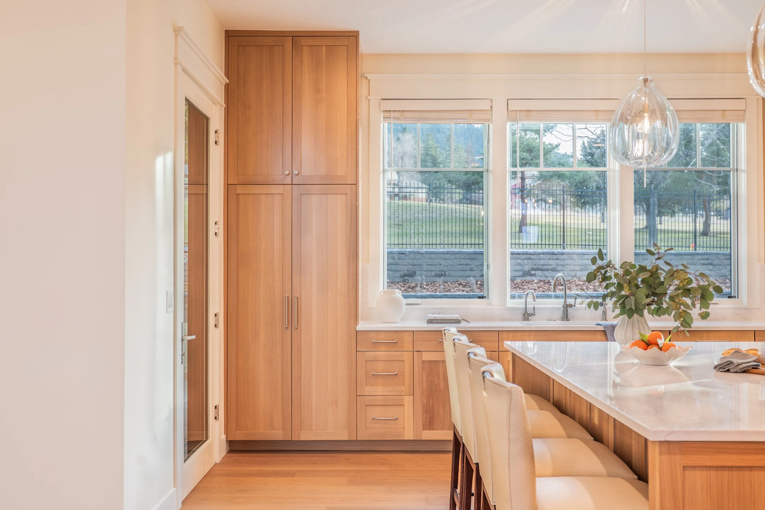 kitchen-countertop-backsplash-rande-lighting-oak-custom-wood-table-design-missoula-montana-home-builder-sink-natural light.jpg