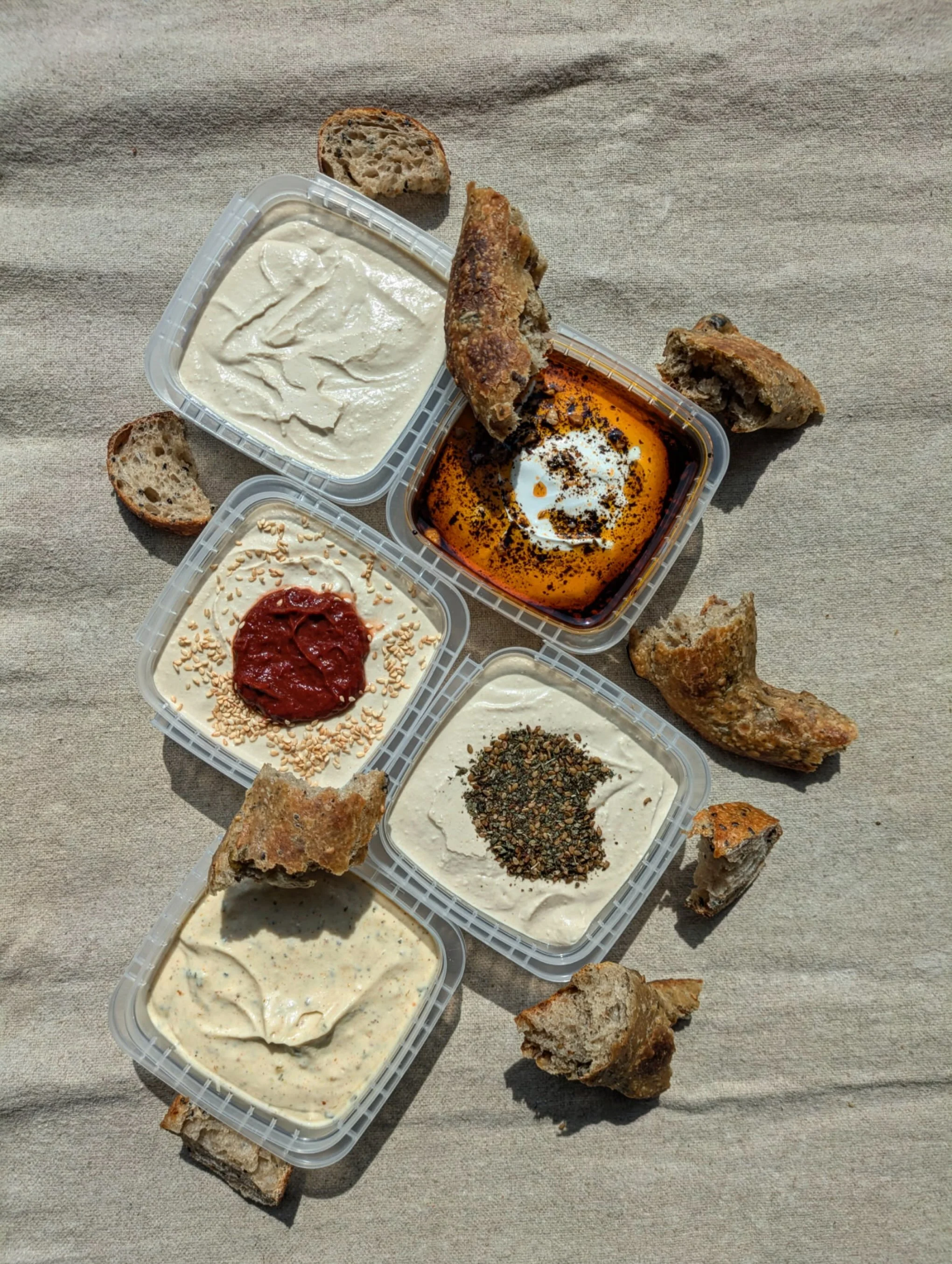 We got some dips for you!!!! 

Many many people have been asking us for dips to go with our snacky breads, and we sure delivered. 

As you may have noticed last week, we started prepackaging different flavors of hummus, labneh with urfa chili crisp, 